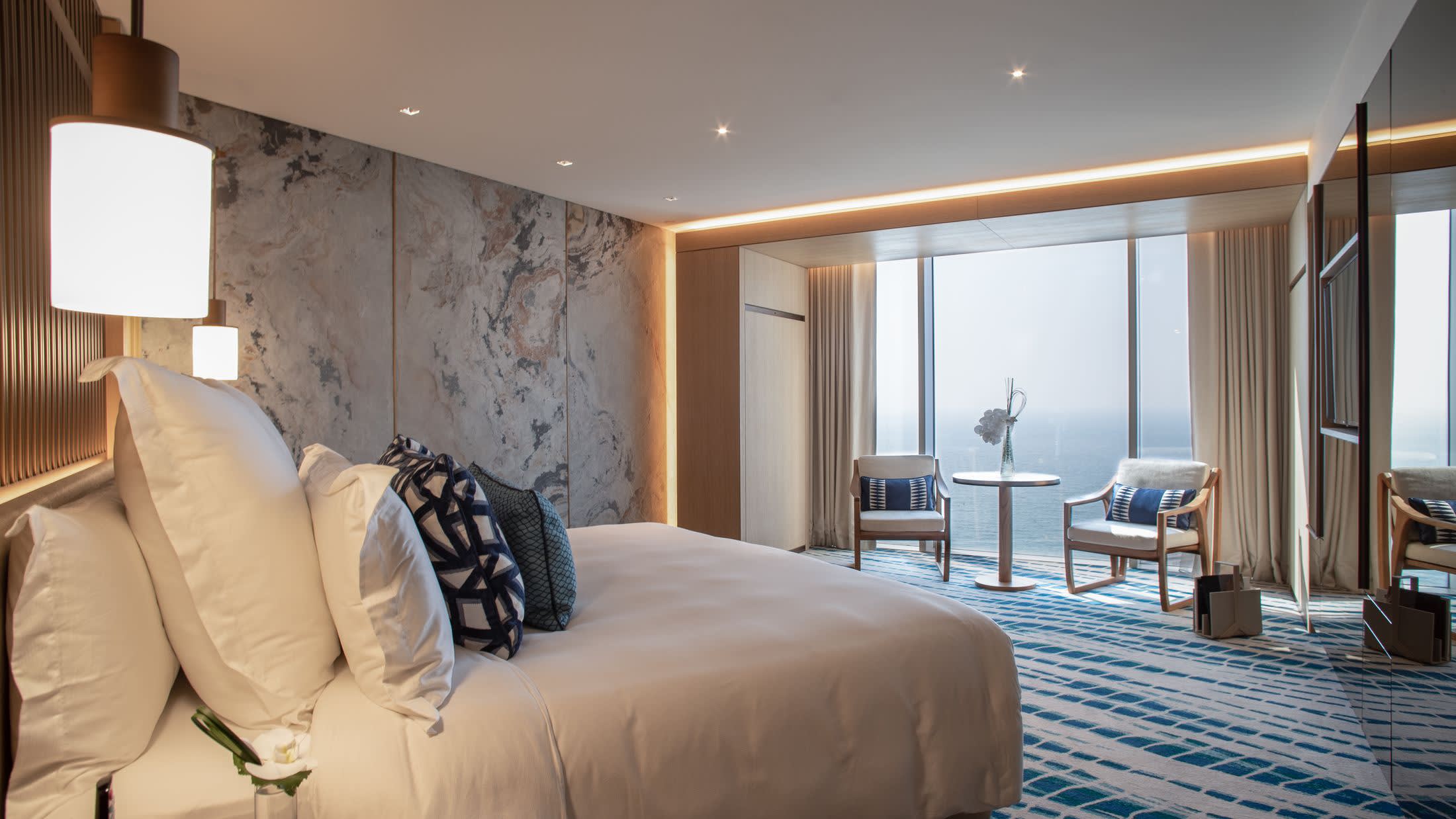 a bedroom with a large bed in a hotel room