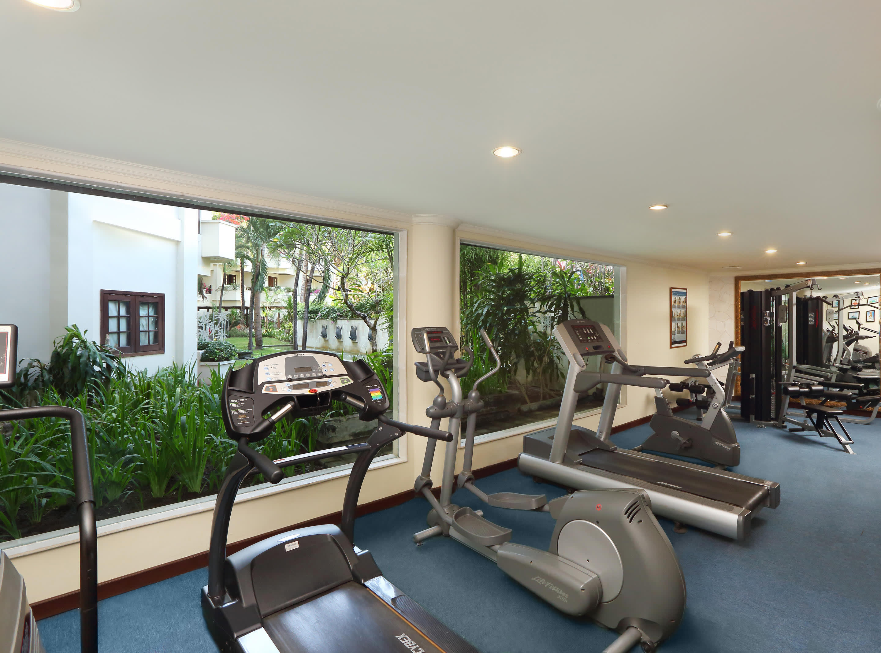 a living room filled with furniture and a large window