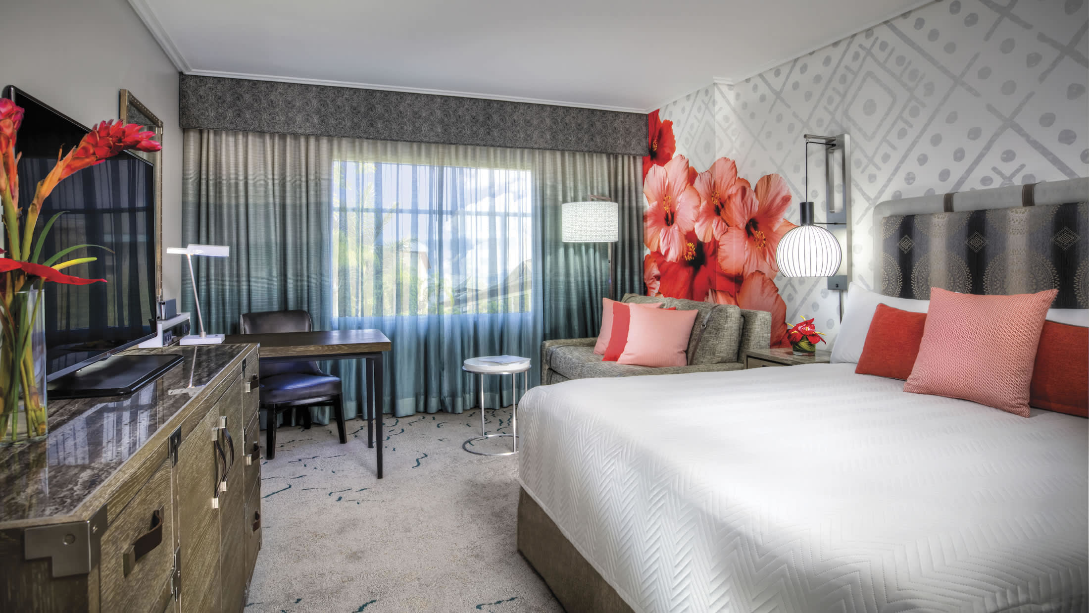 a bedroom with a bed and a chair in a room