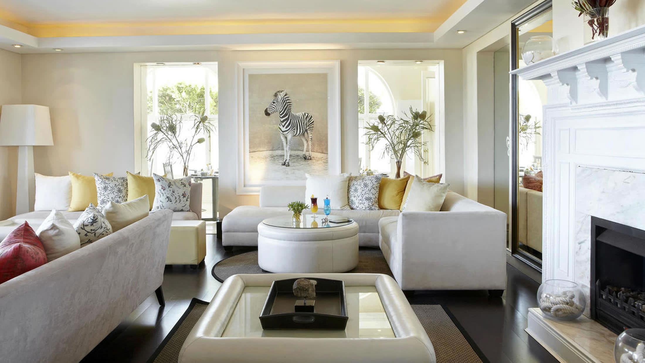 a living room filled with furniture and a fire place