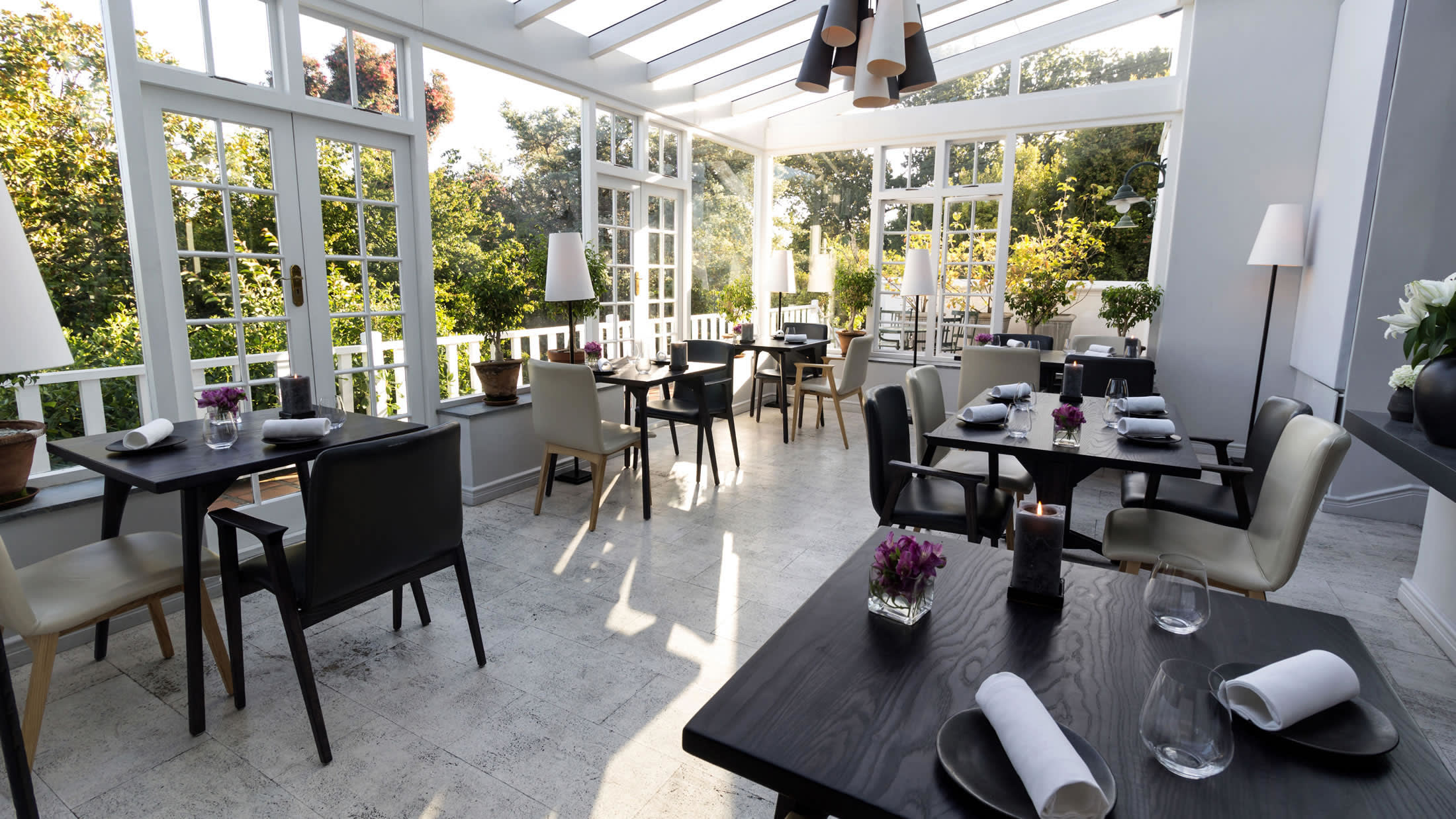 a living room filled with furniture and a large window