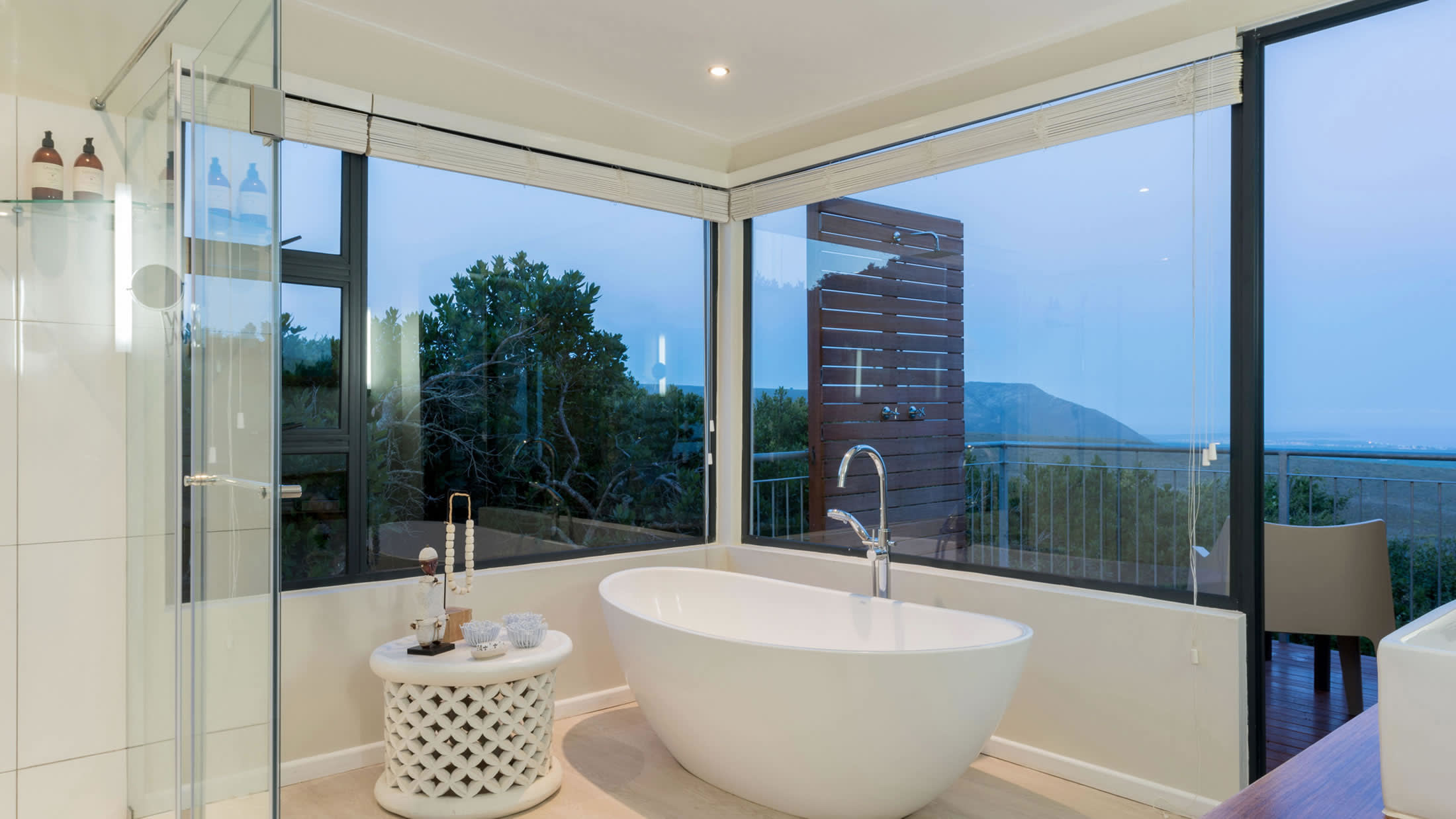 a large white tub next to a window