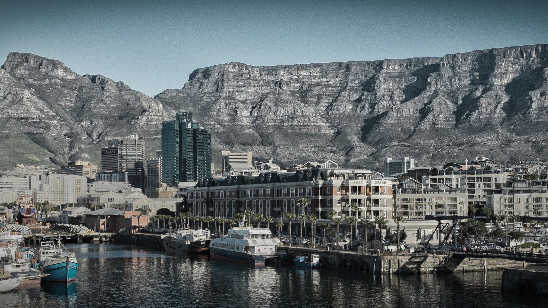 a harbor with a mountain in the background