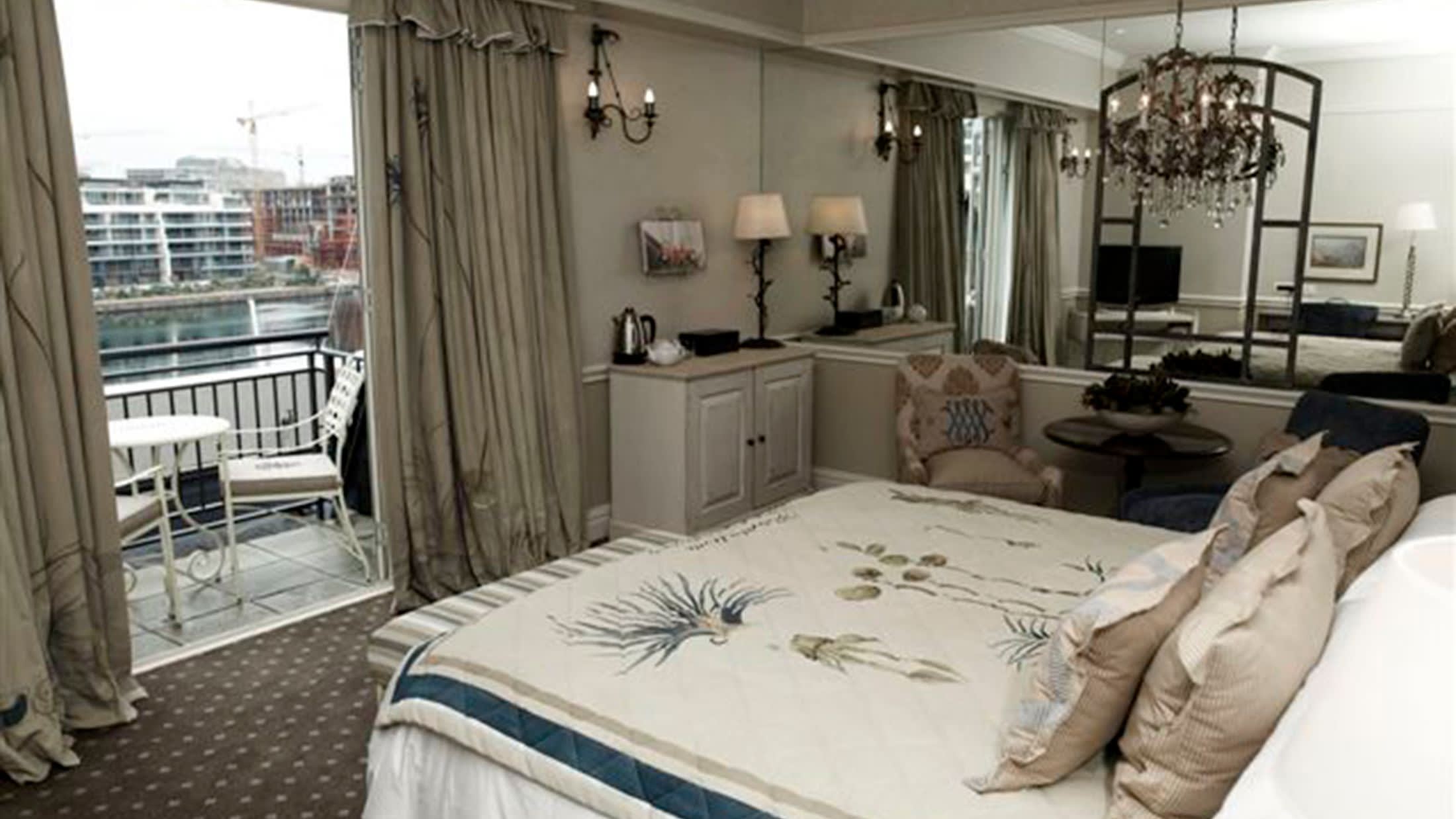 a bedroom with a bed and a large window