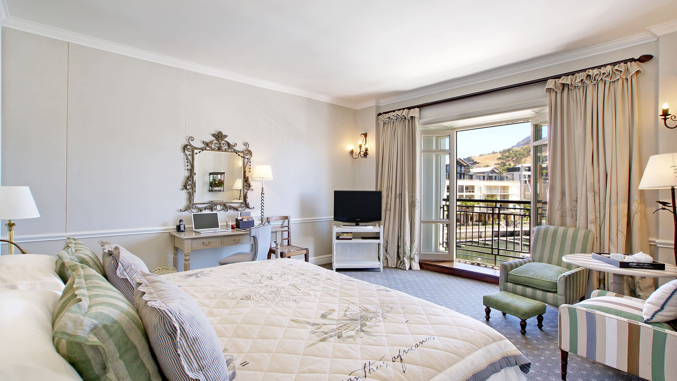 a bedroom with a large bed in a hotel room