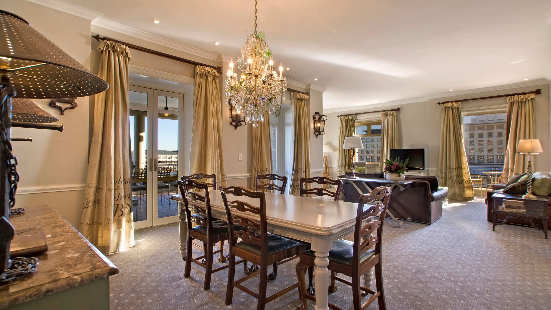 a living room filled with furniture and a large window