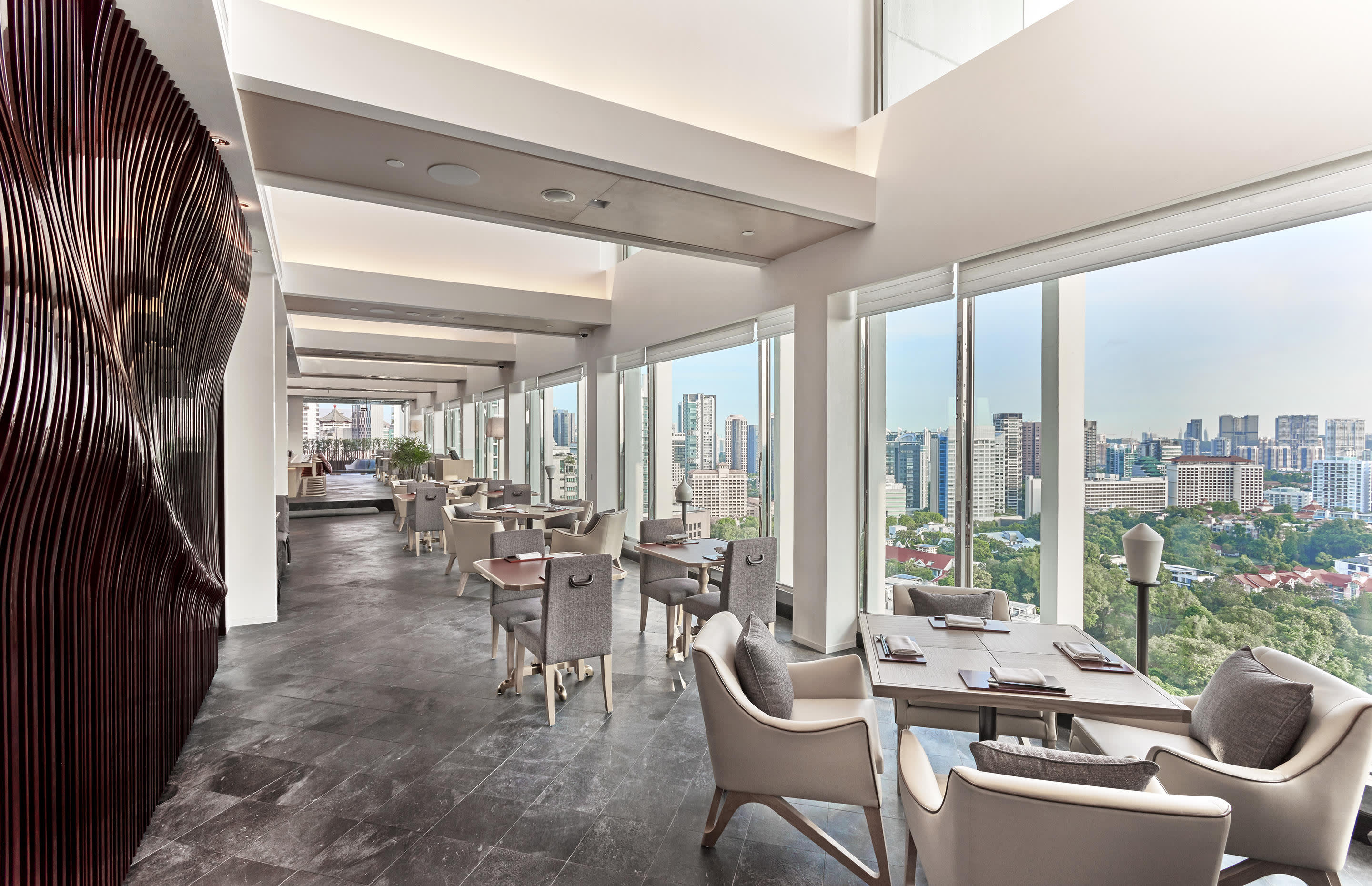 a room filled with furniture and a large window