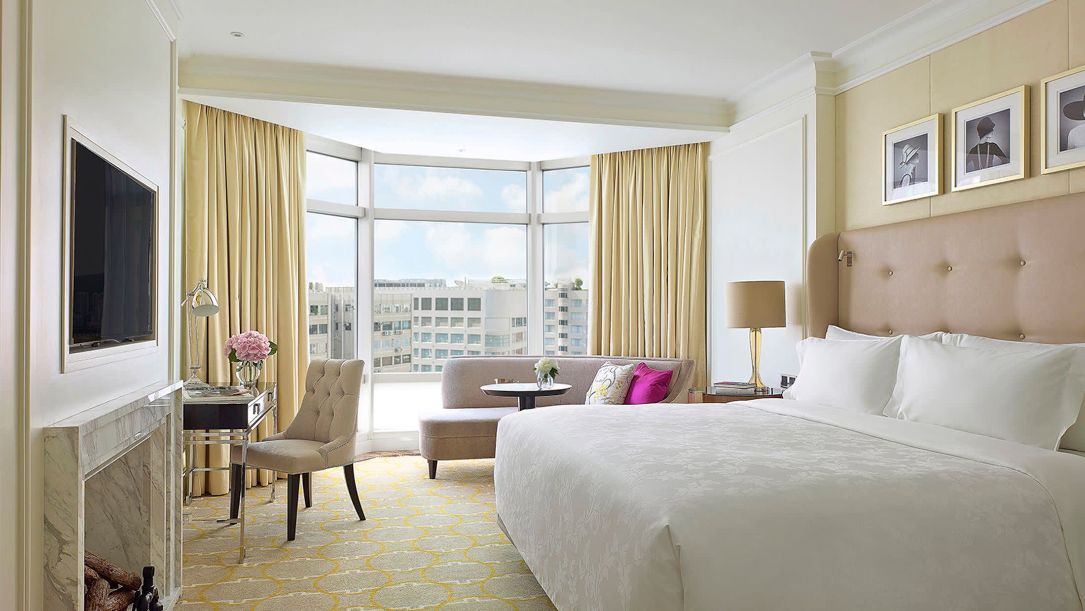 a bedroom with a large bed in a hotel room