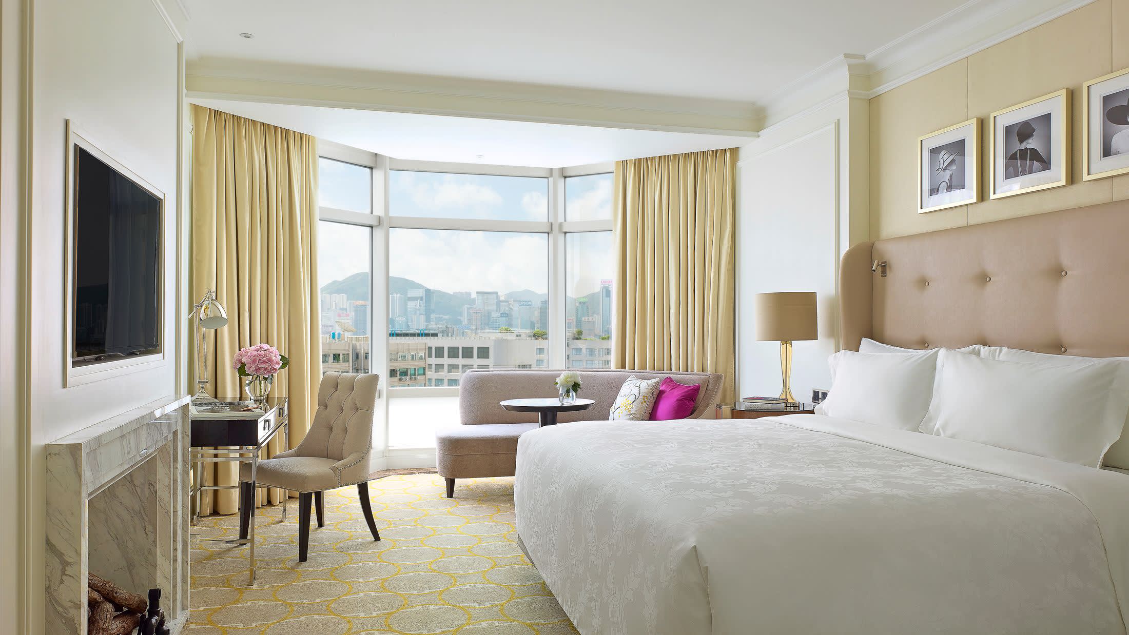 a bedroom with a large bed in a hotel room