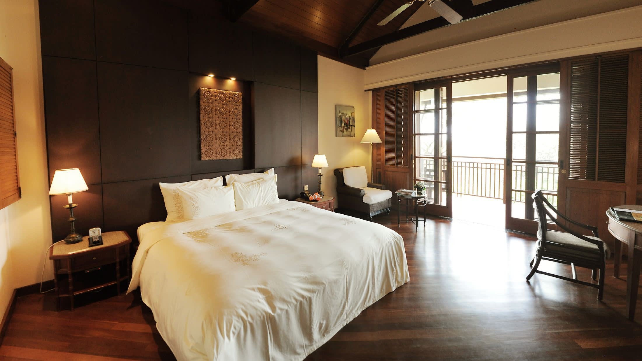 a bedroom with a large bed in a hotel room