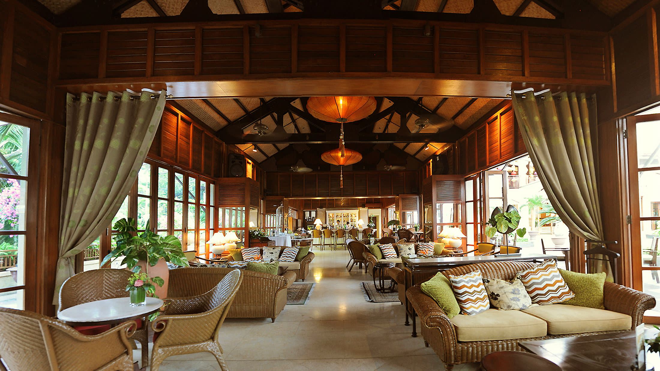 a living room filled with furniture and a large window