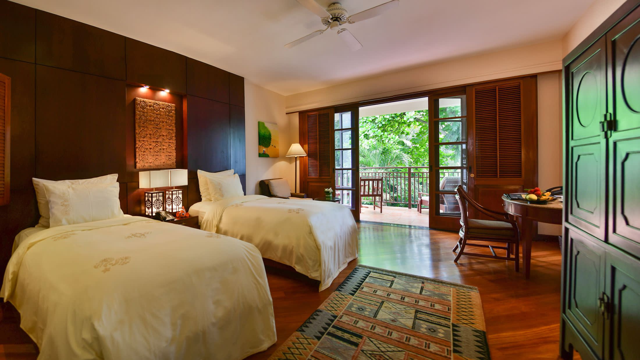a bedroom with a large bed in a hotel room