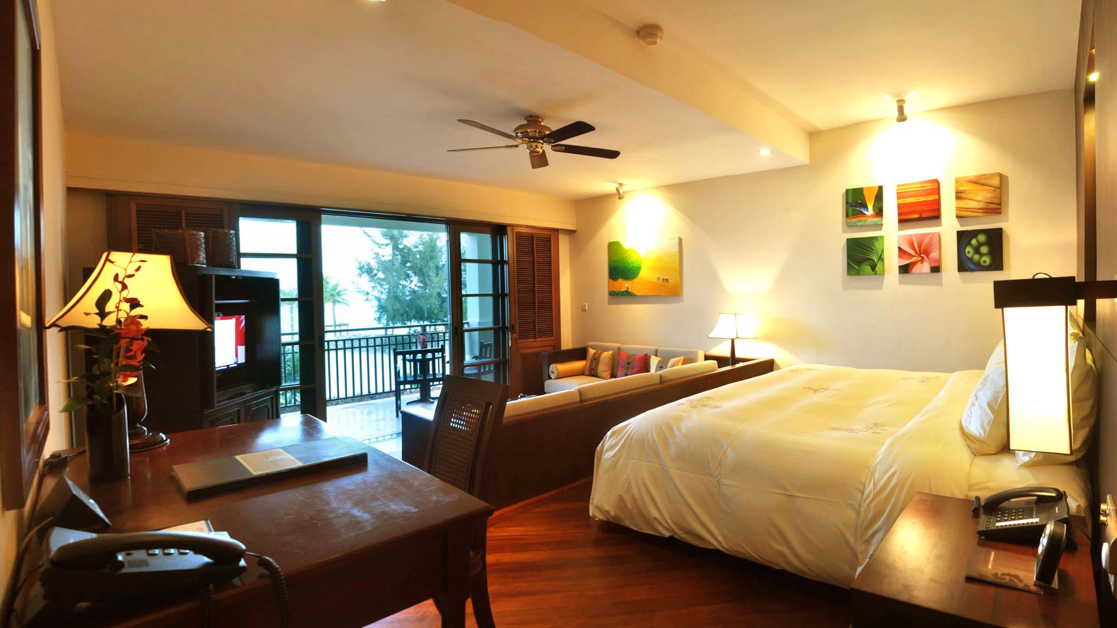 a bedroom with a view of a living room