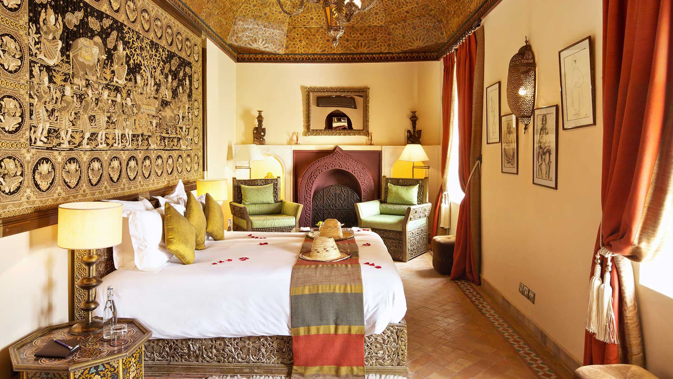 a bedroom with a bed and a mirror in a room