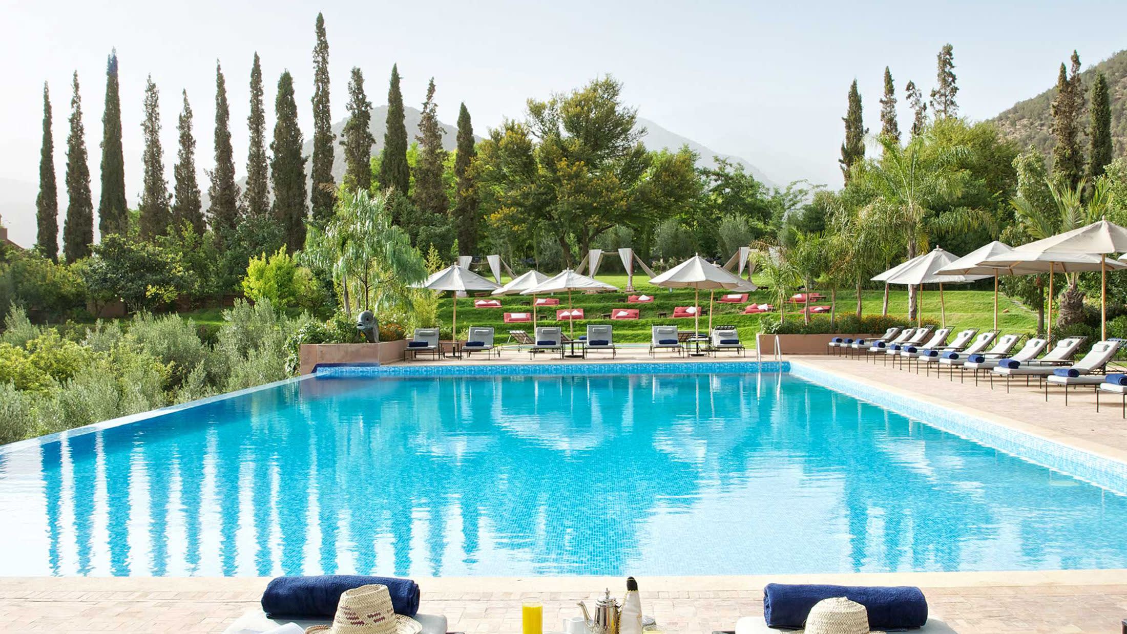 a pool next to a body of water