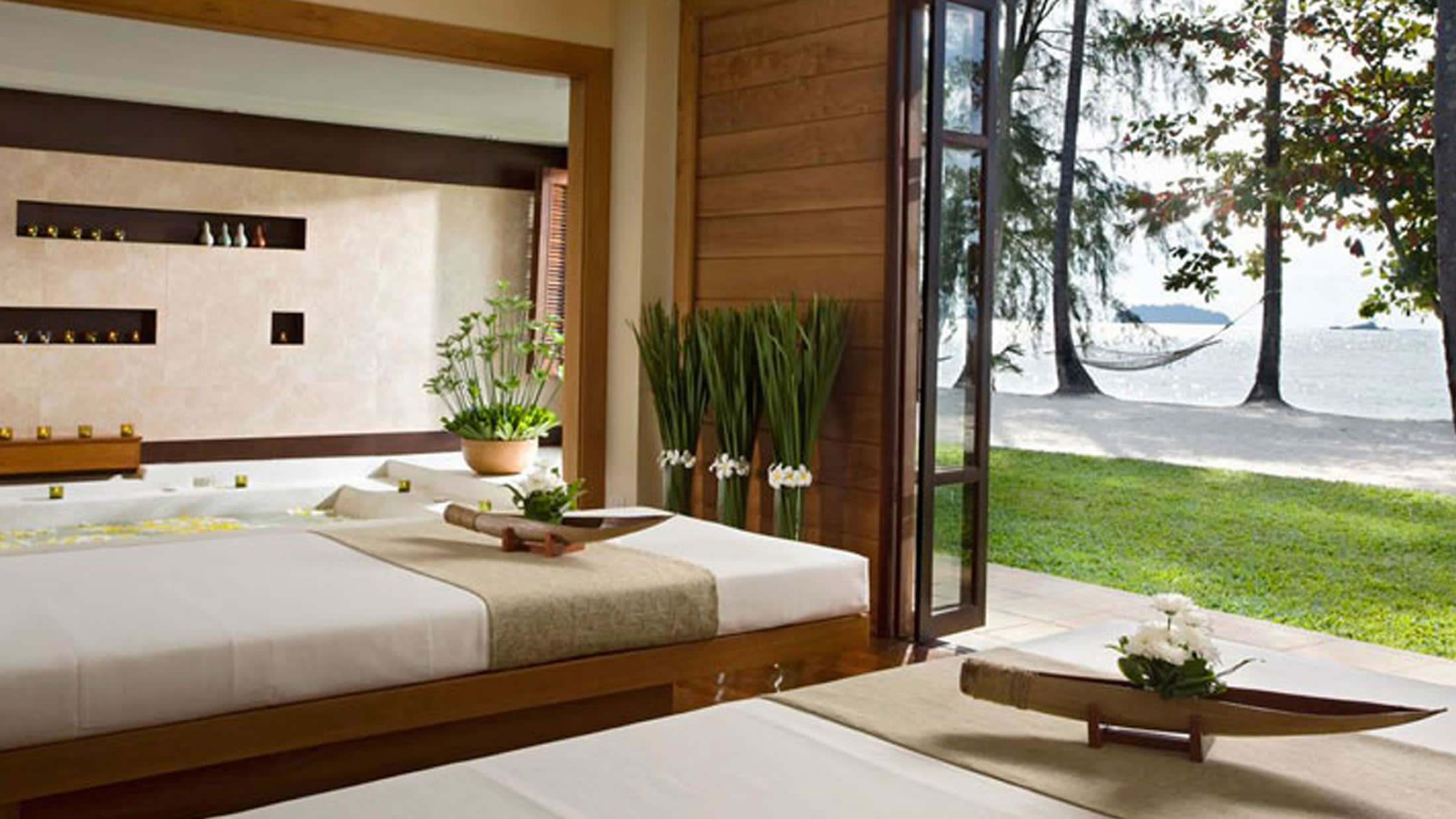 a bedroom with a large window