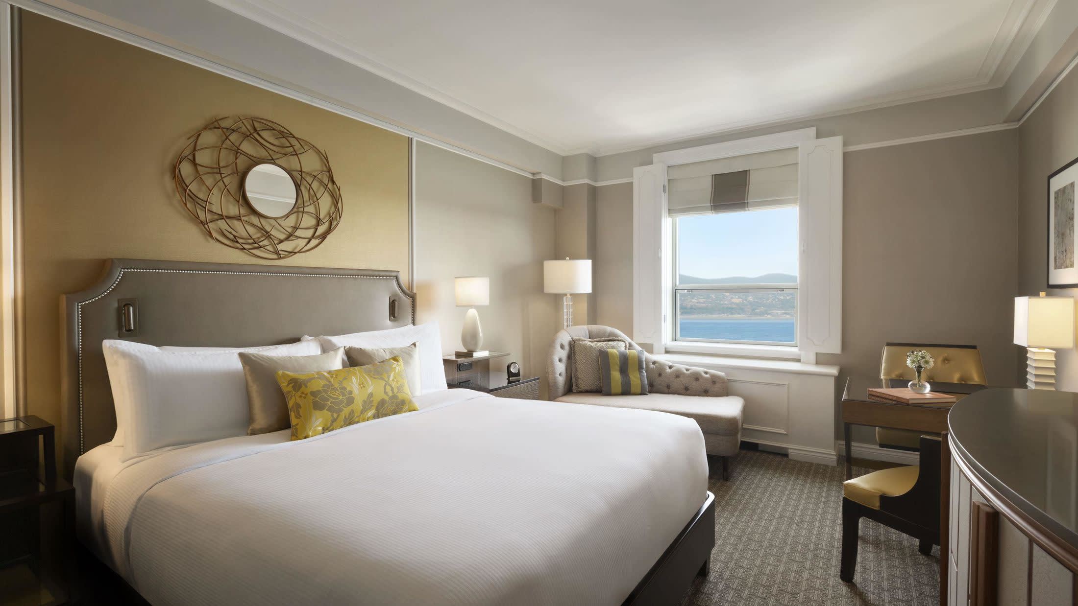 a bedroom with a large bed in a hotel room