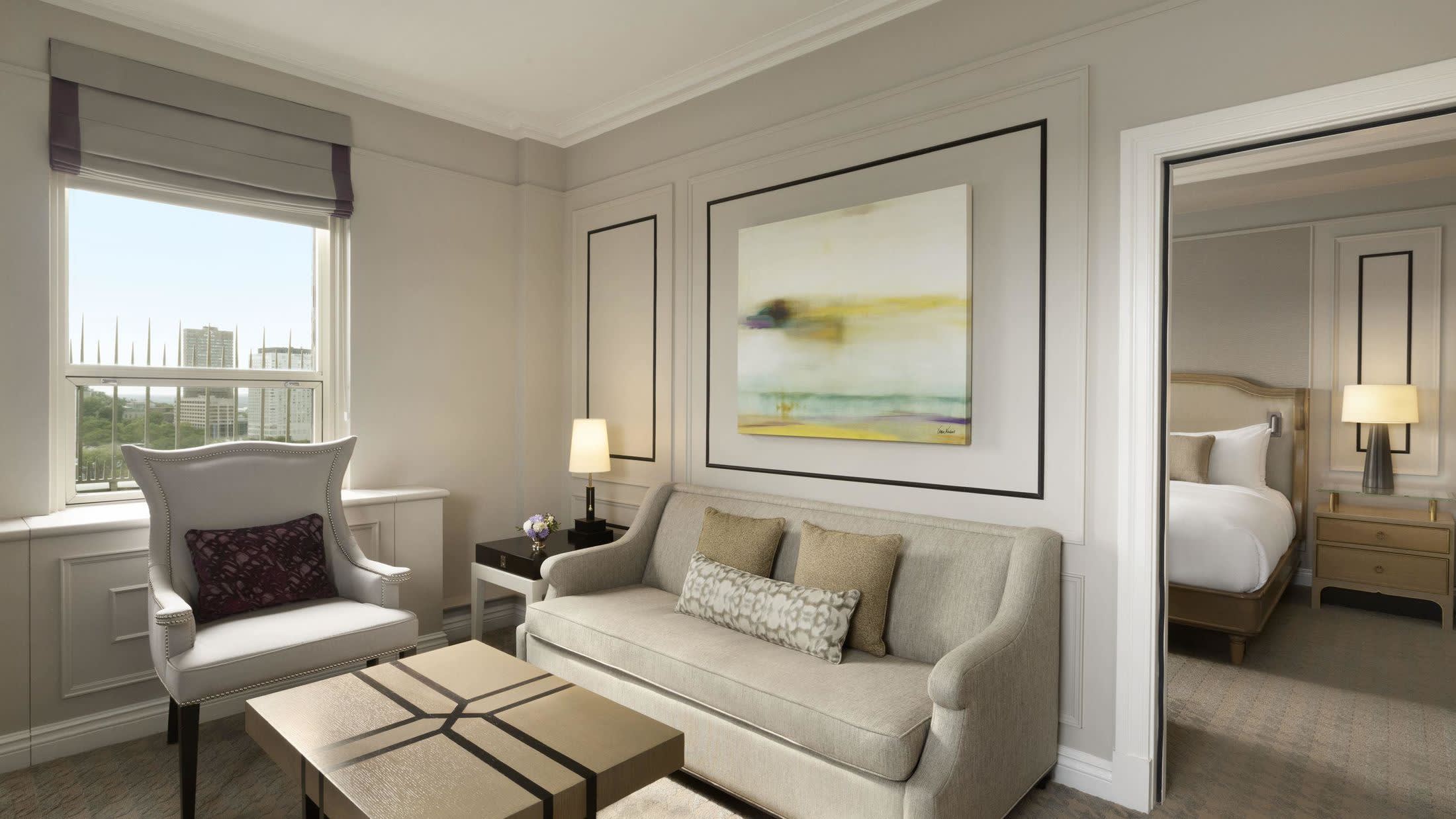 a living room filled with furniture and a large window