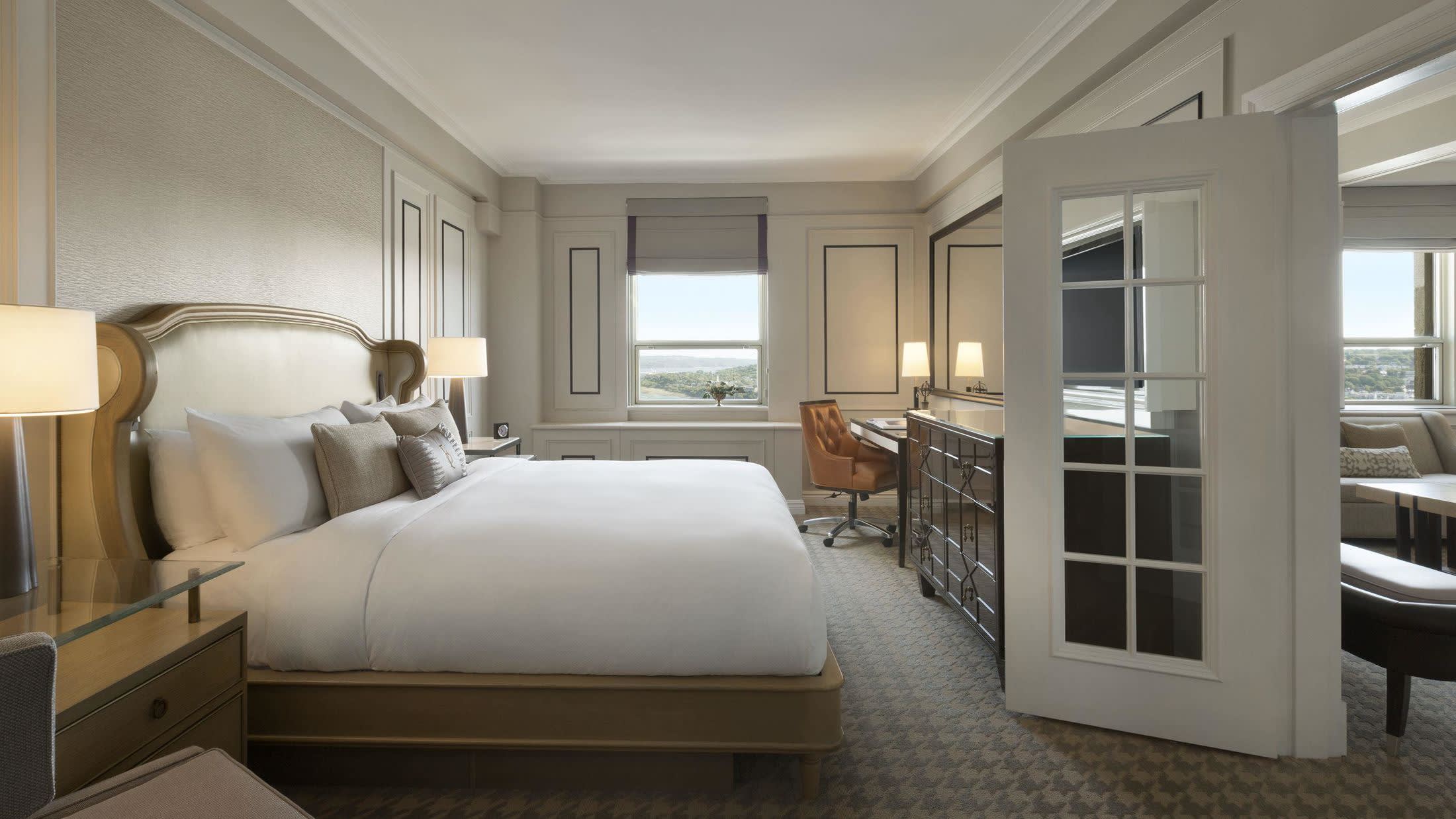 a bedroom with a large bed in a room