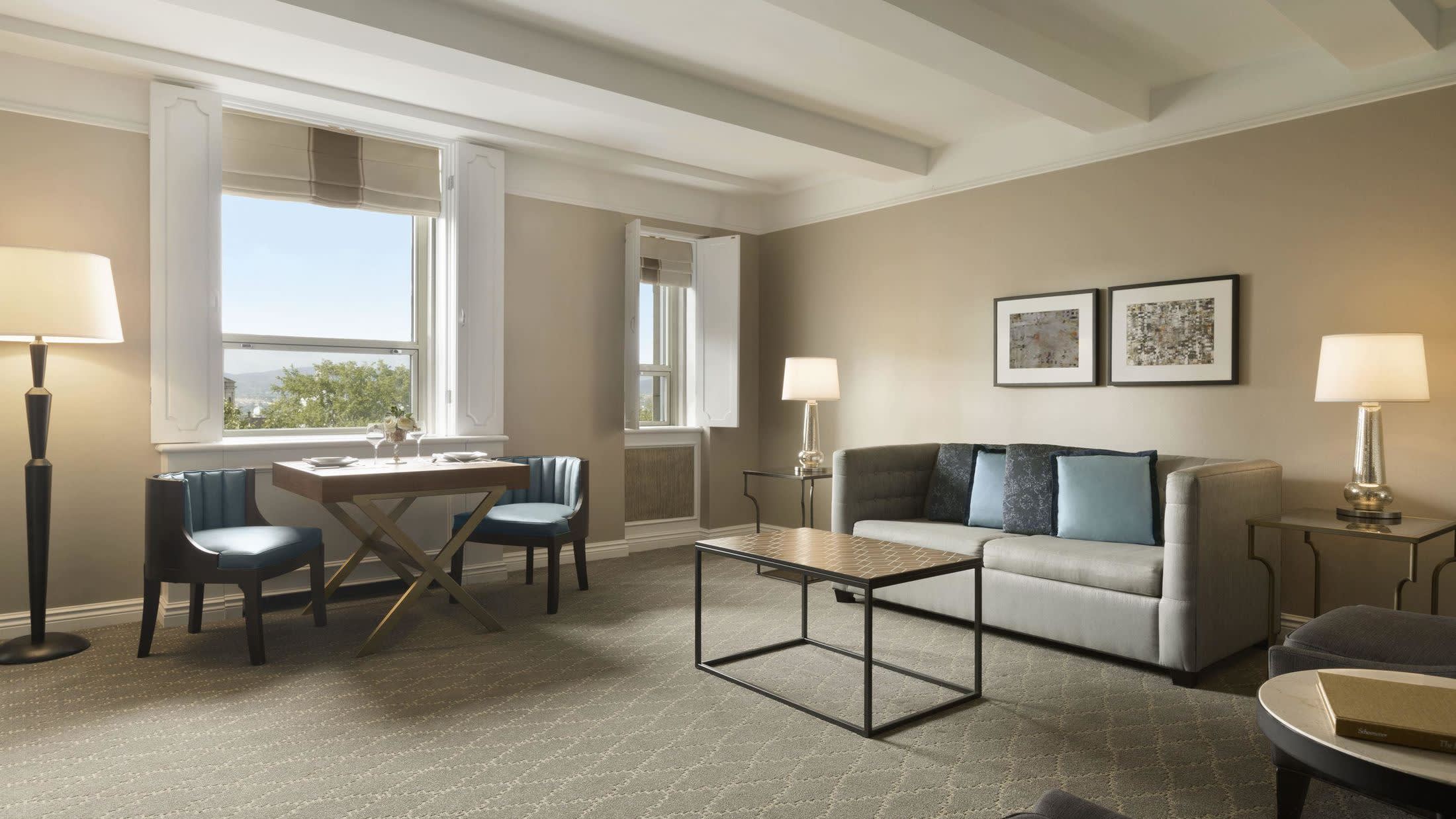 a living room filled with furniture and a large window