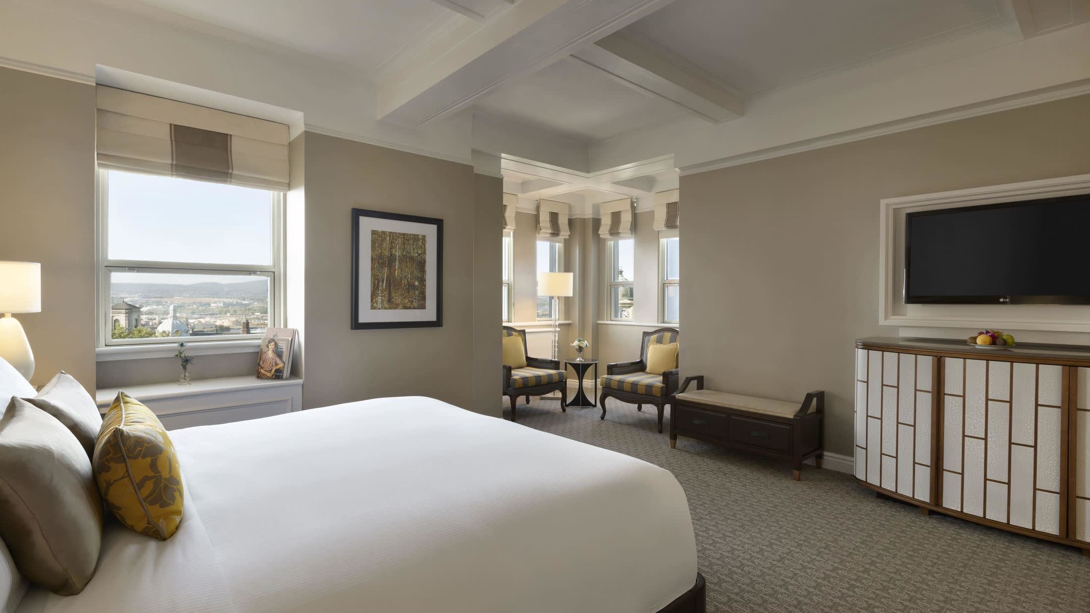 a bedroom with a large bed in a hotel room