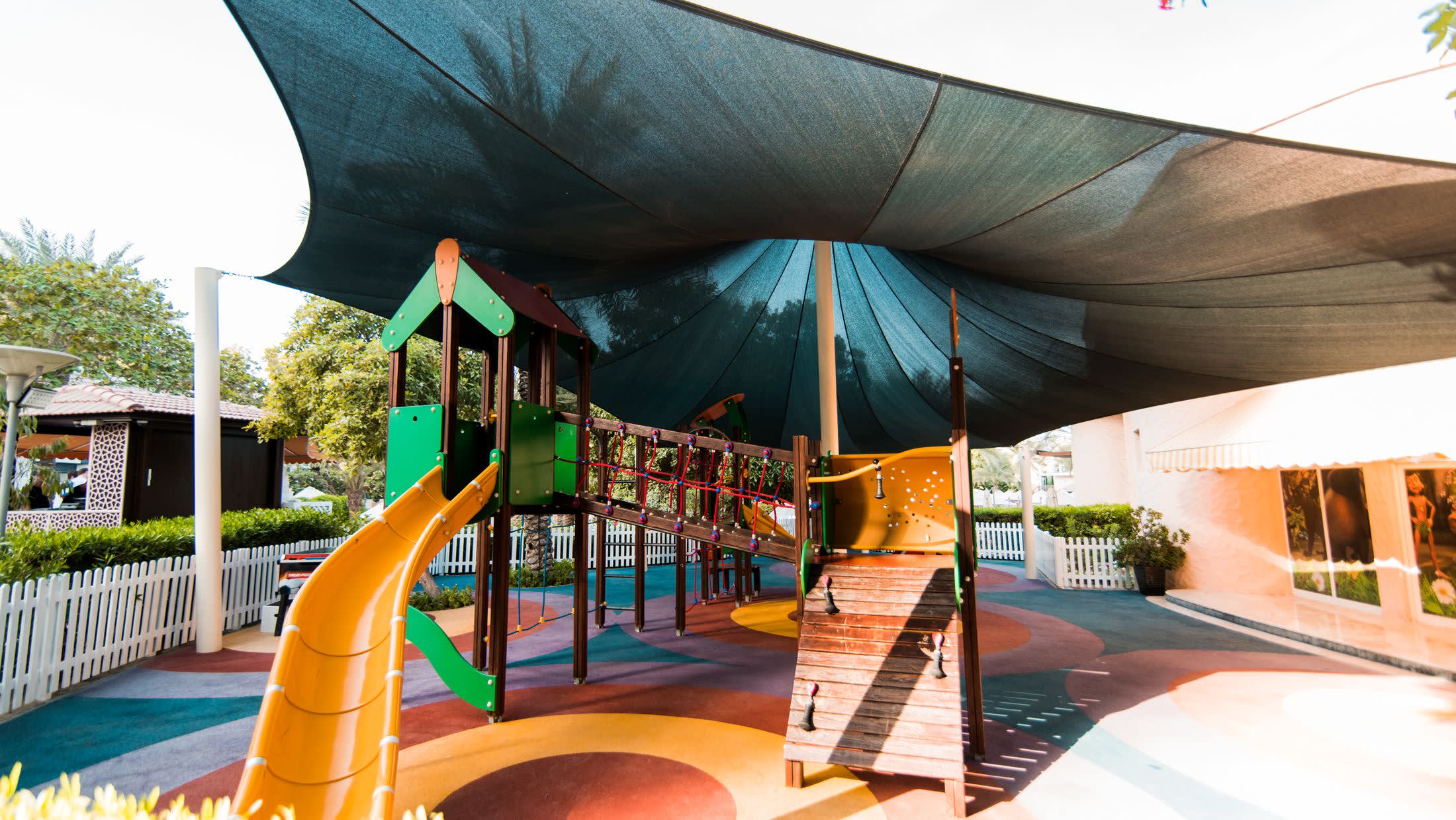 a table topped with a blue umbrella
