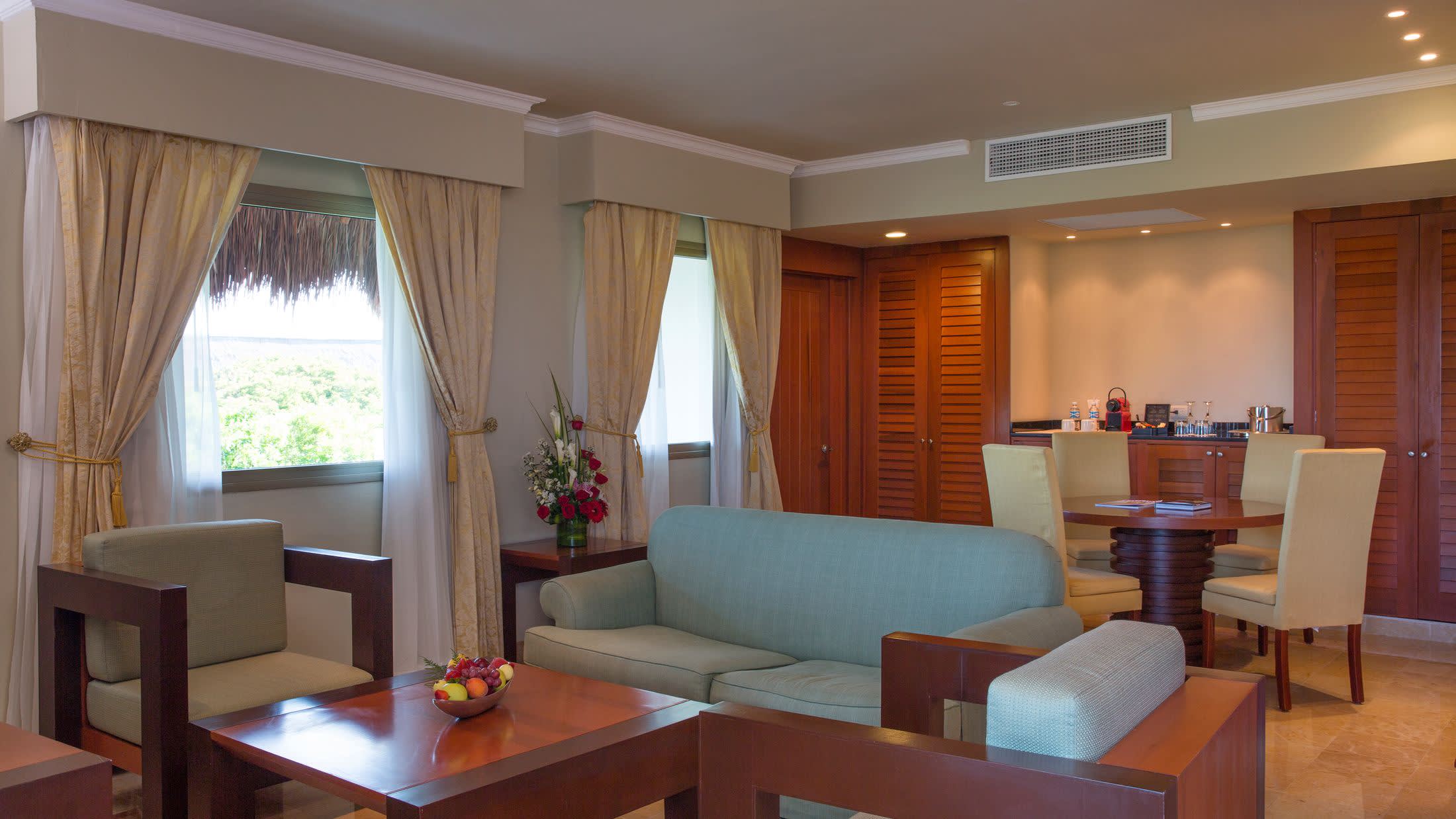 a living room filled with furniture and a large window