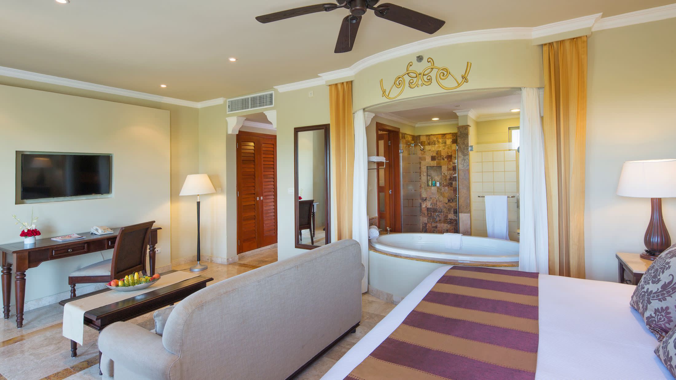 a bedroom with a large bed in a hotel room