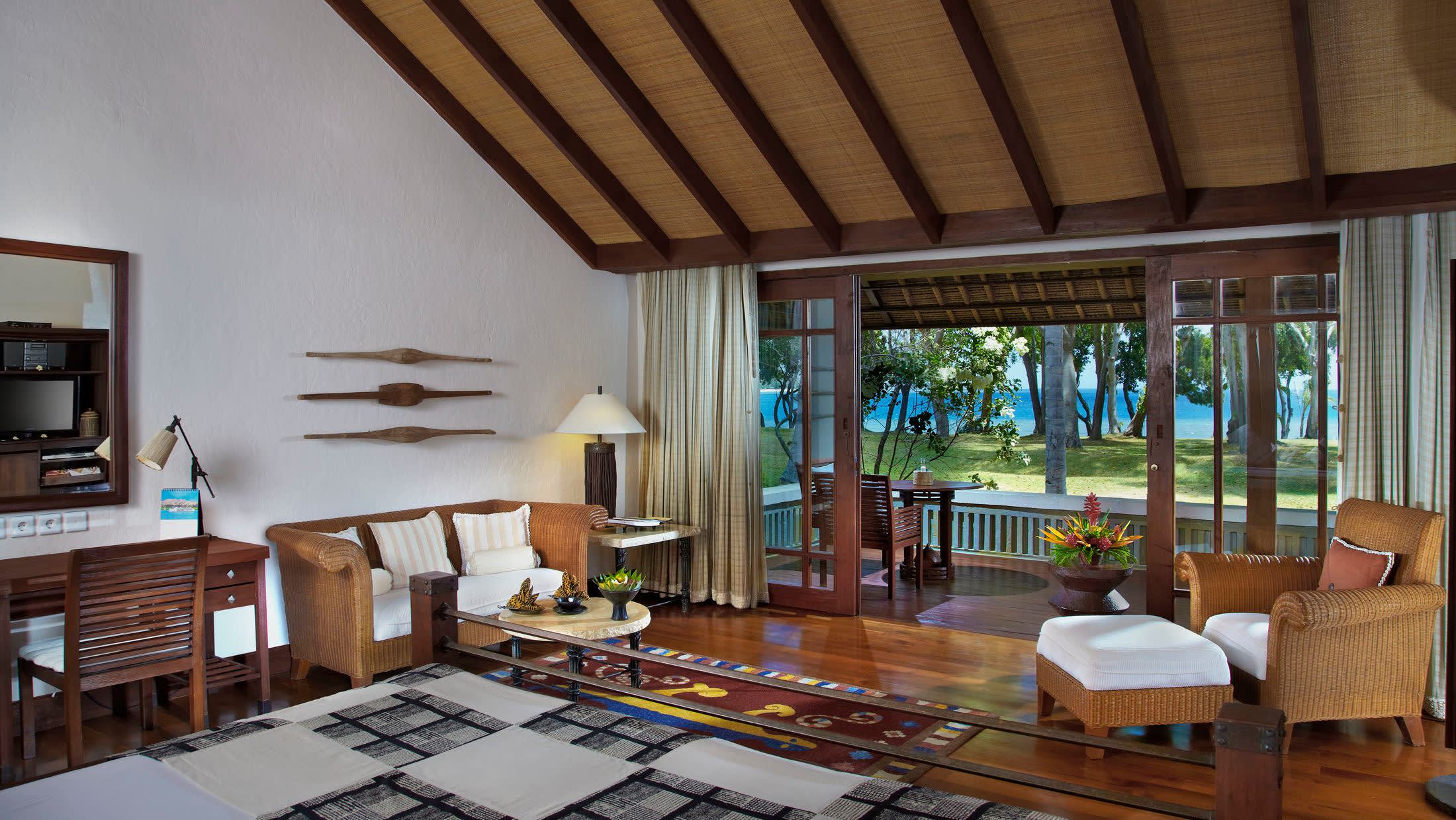 a living room filled with furniture and a large window