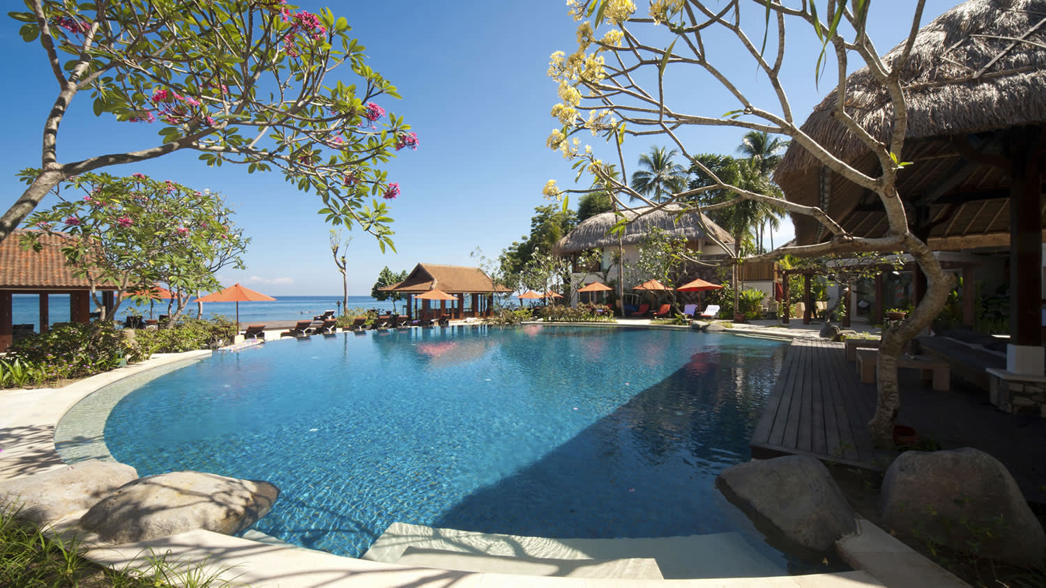 a pool next to a body of water