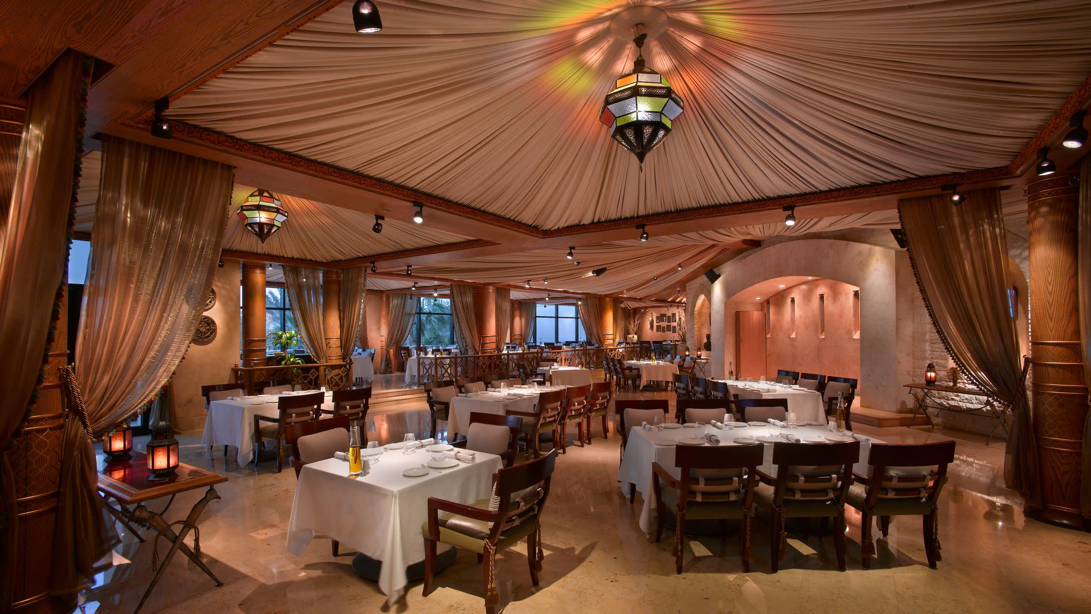 a room filled with furniture and a table