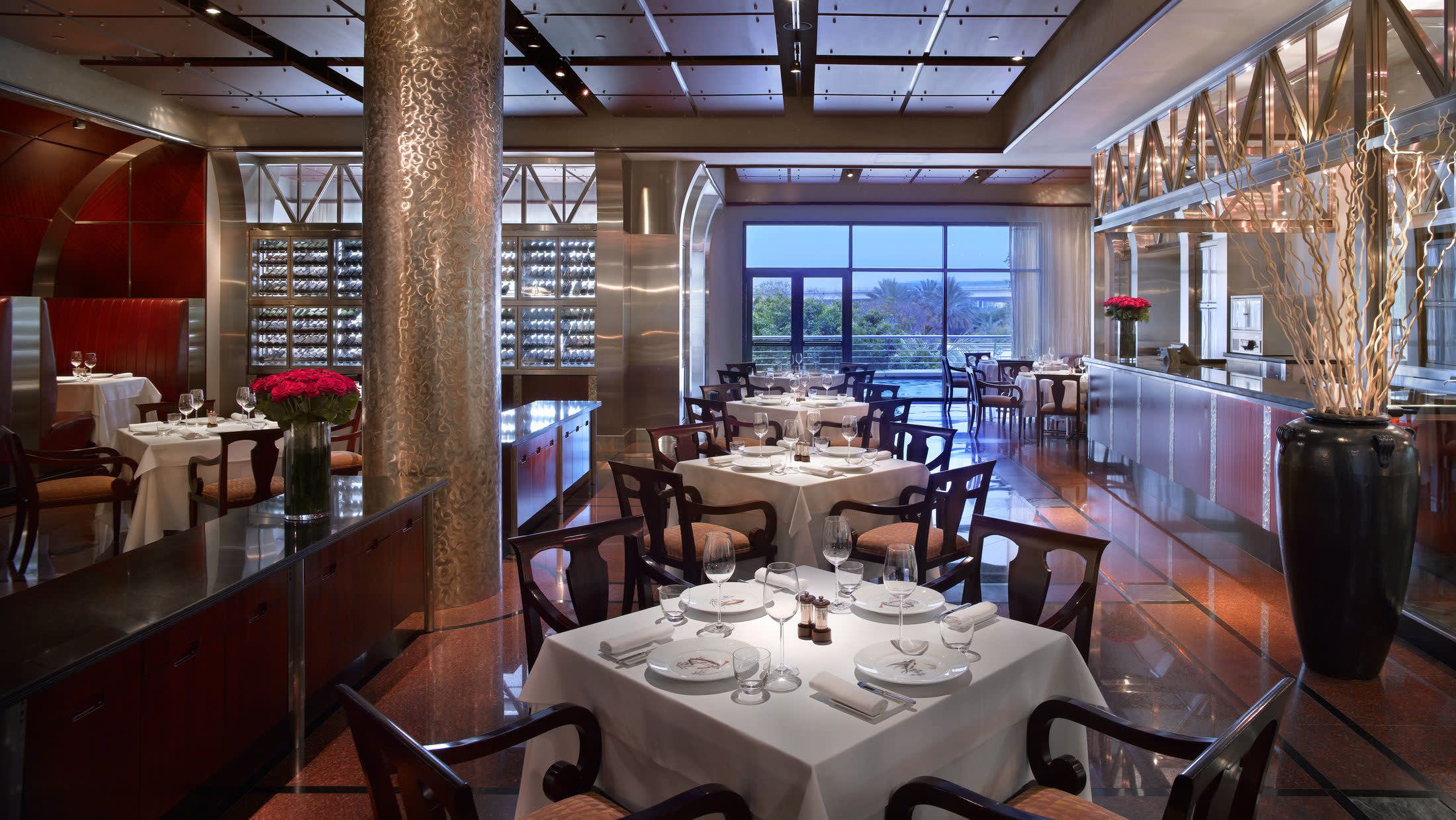 a dining room table in front of a window