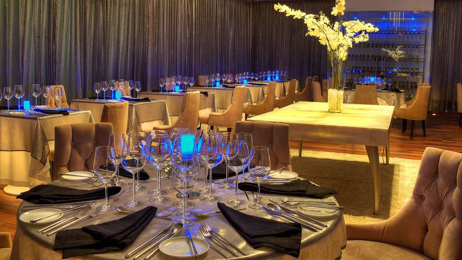 a table filled with wine glasses