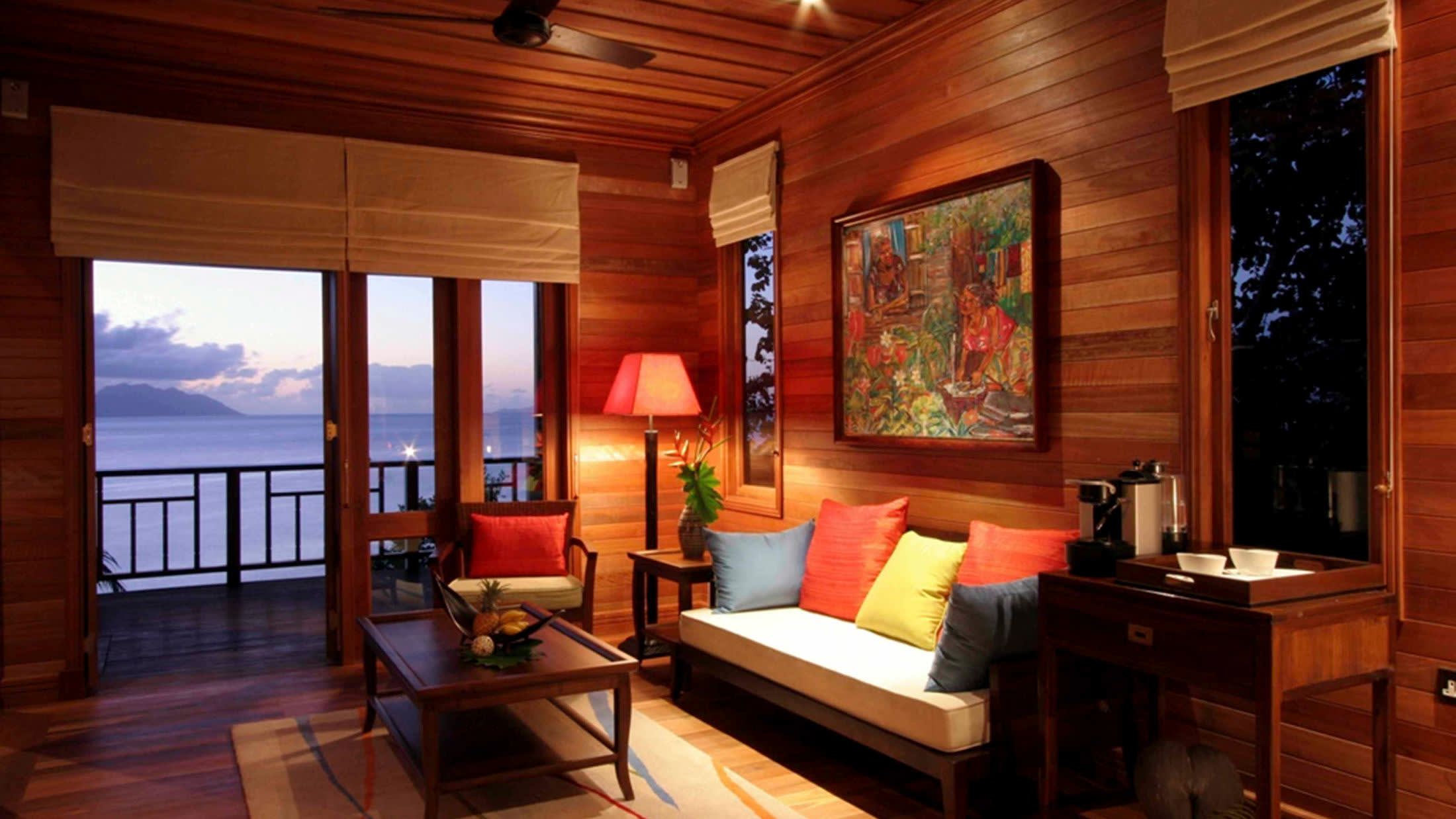 a living room filled with furniture and a large window