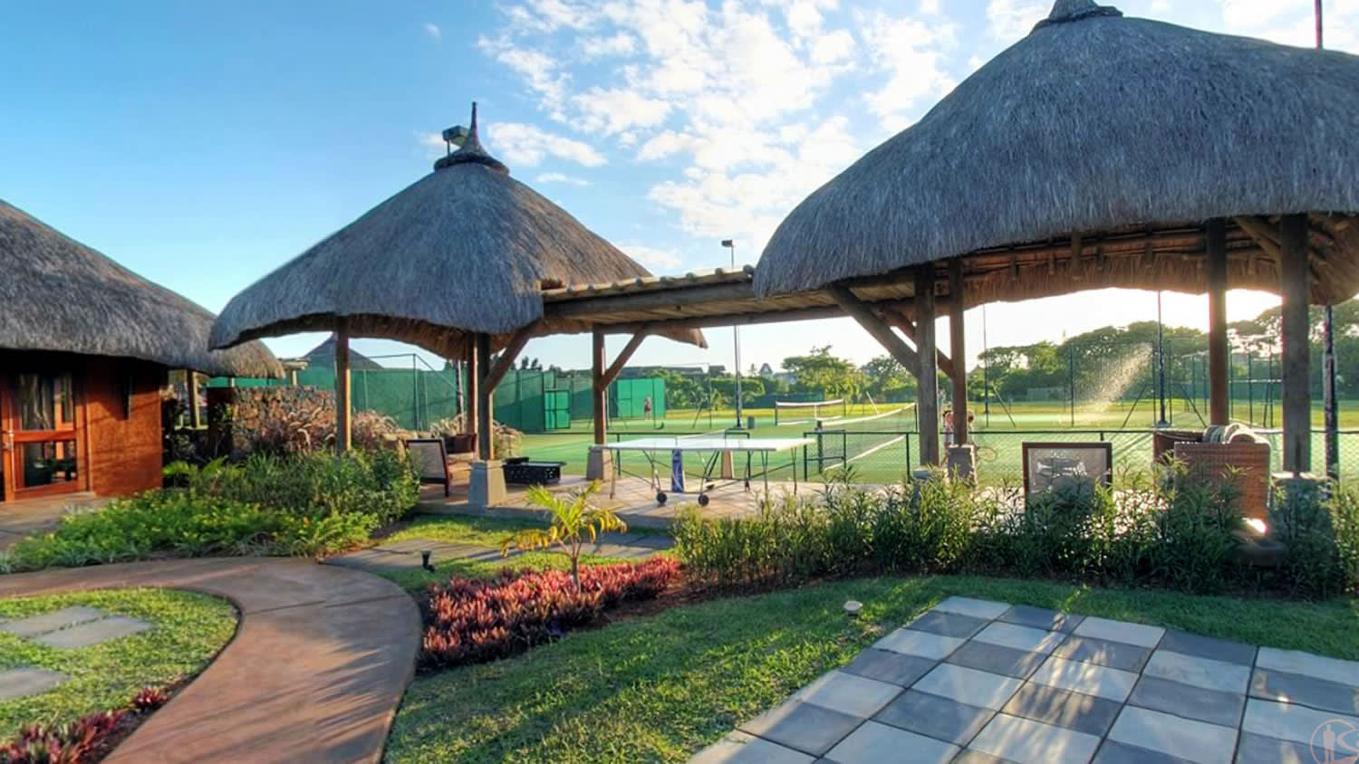 a house with a green umbrella