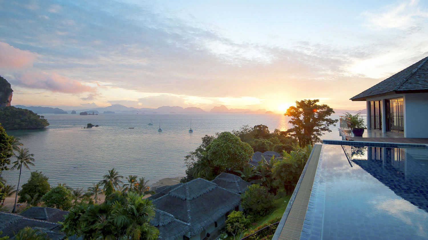 a house next to a body of water