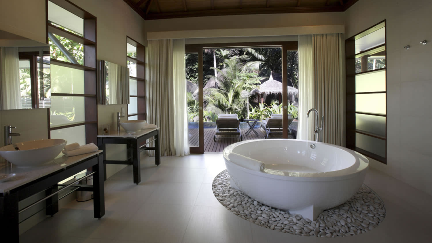 a large white tub next to a window