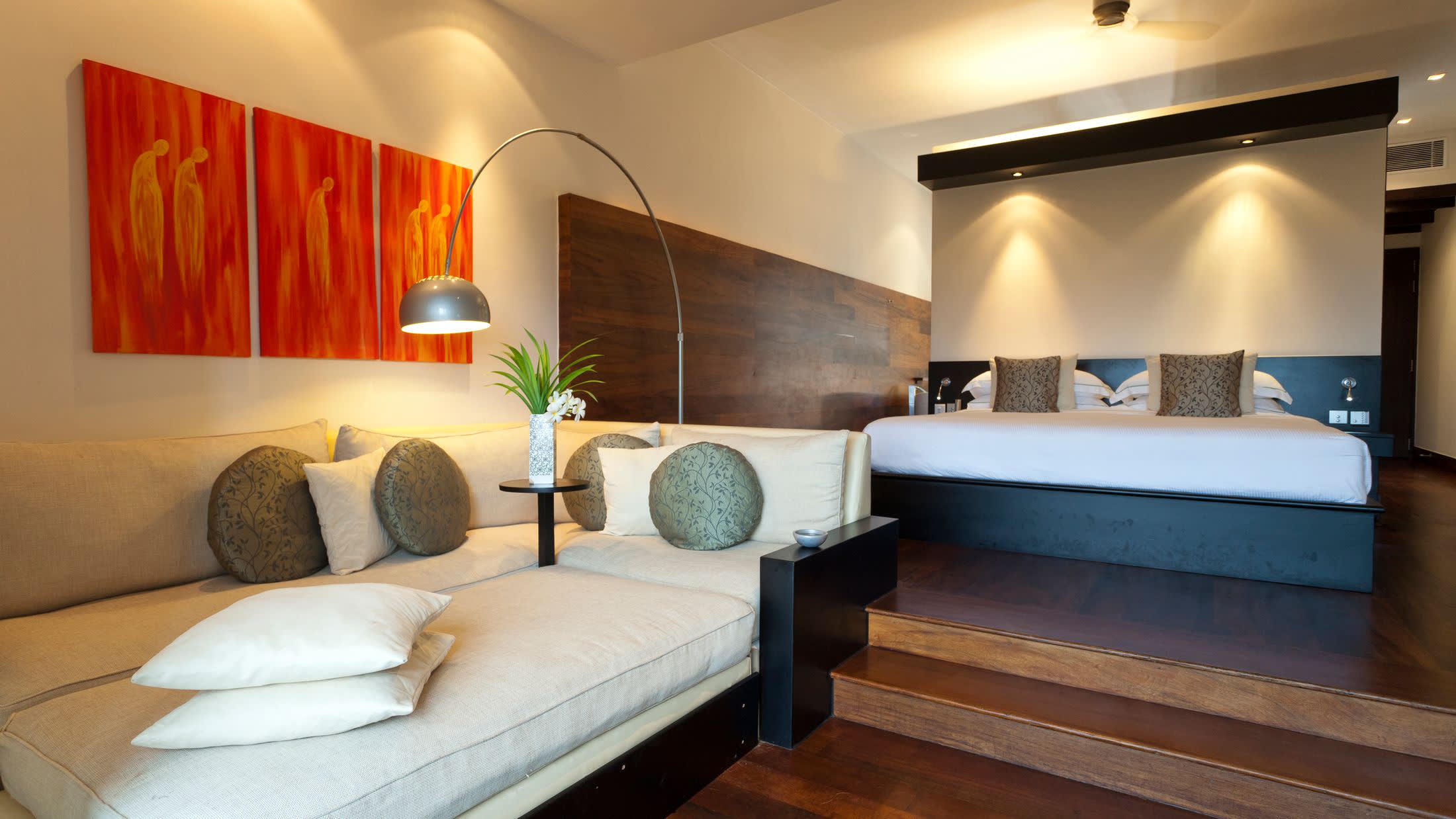 a bedroom with a view of a living room