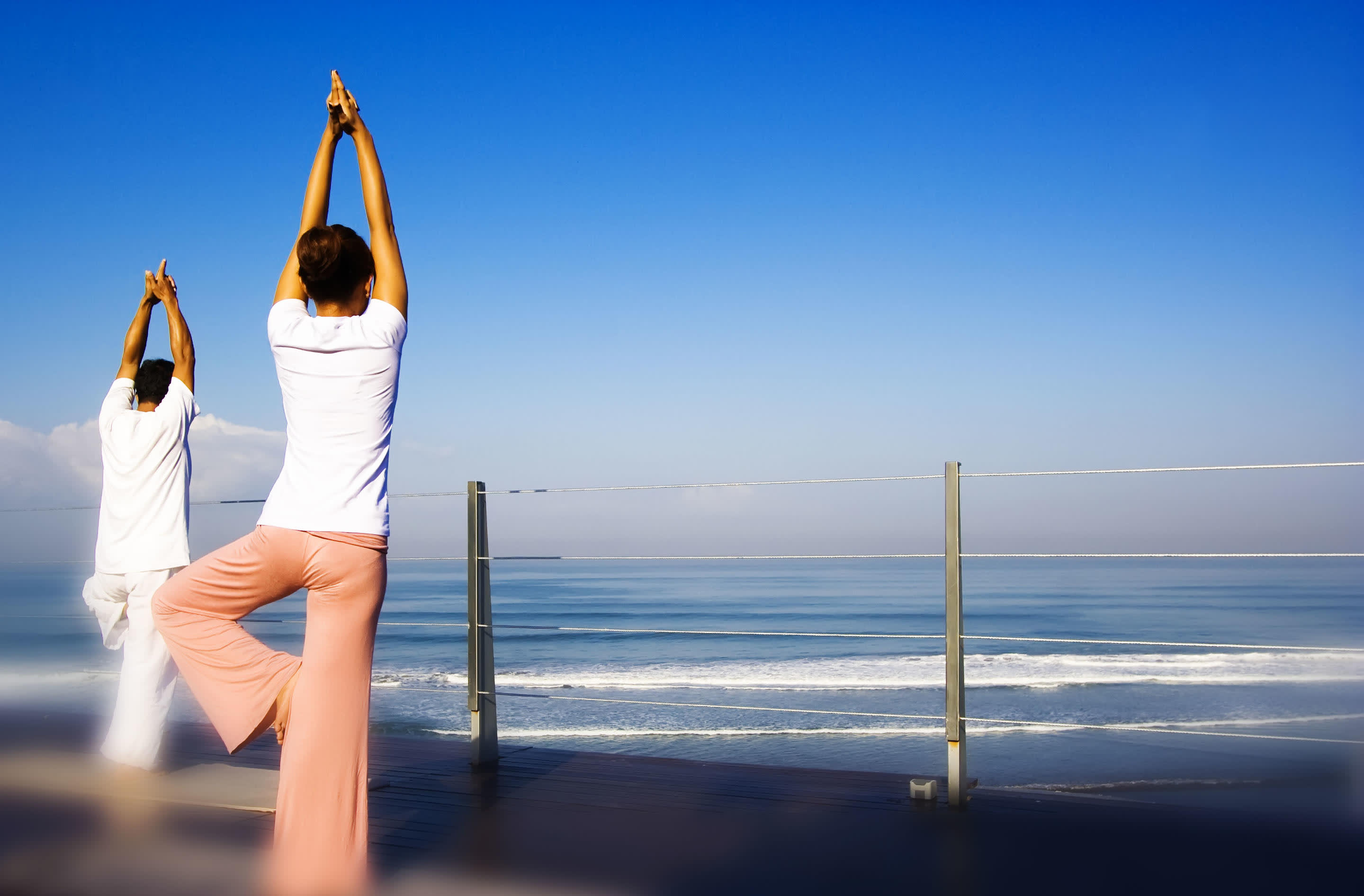 a person standing next to a body of water
