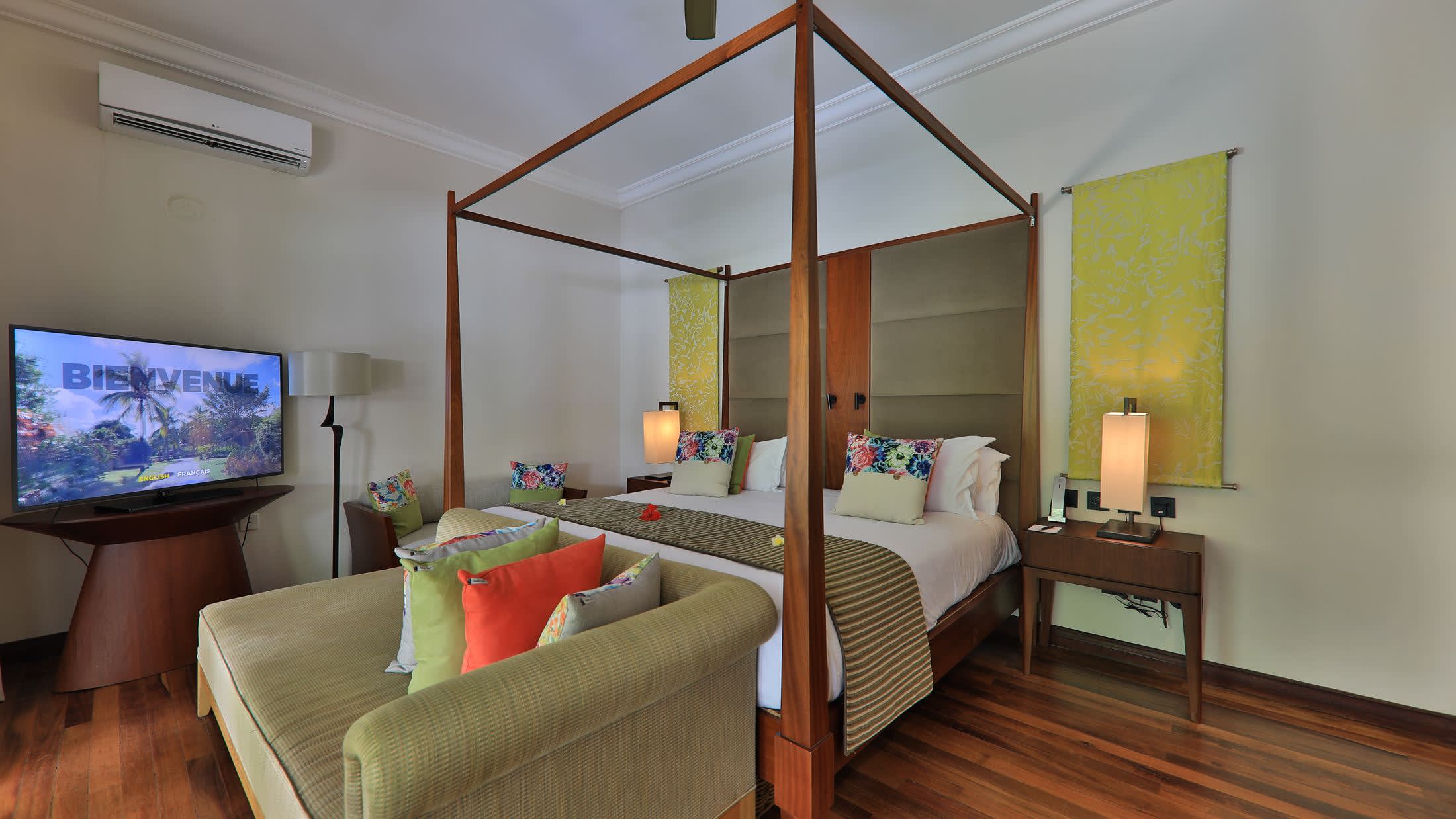 a bedroom with a view of a living room