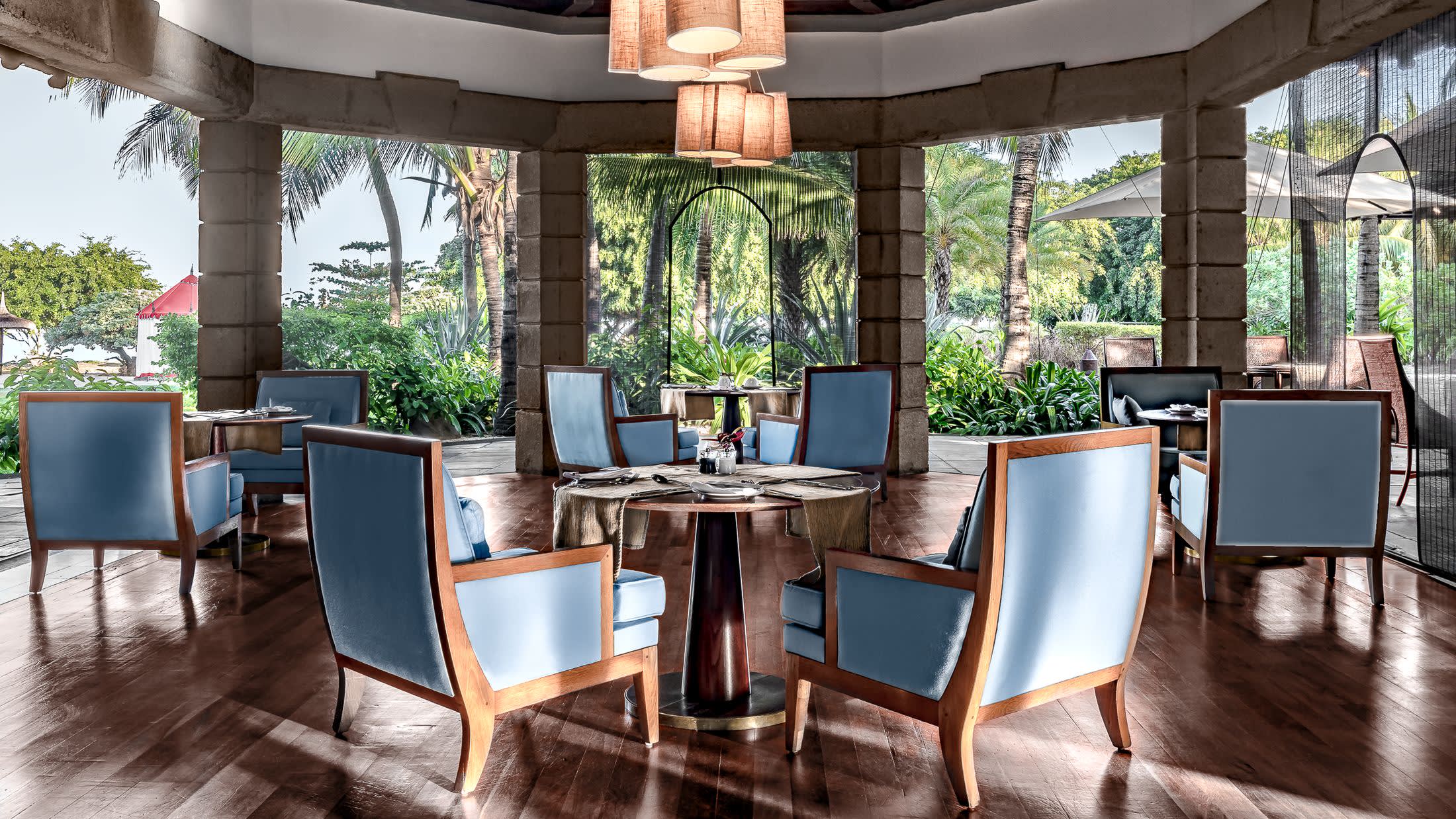 a living room filled with furniture and a large window