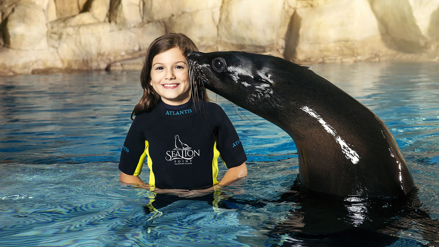 a person standing next to a body of water