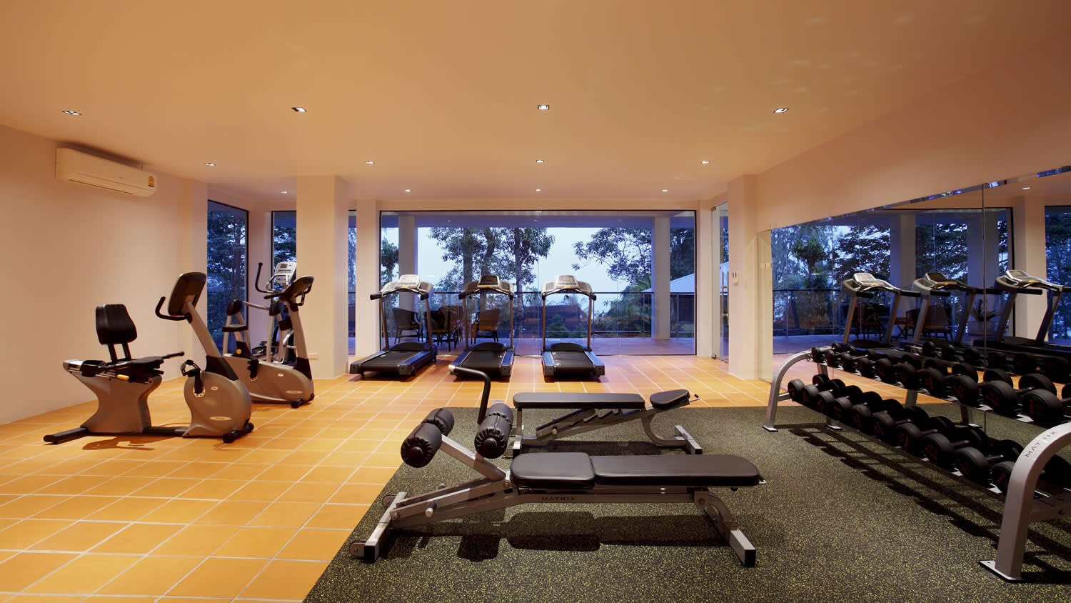 a living room filled with furniture and a large window