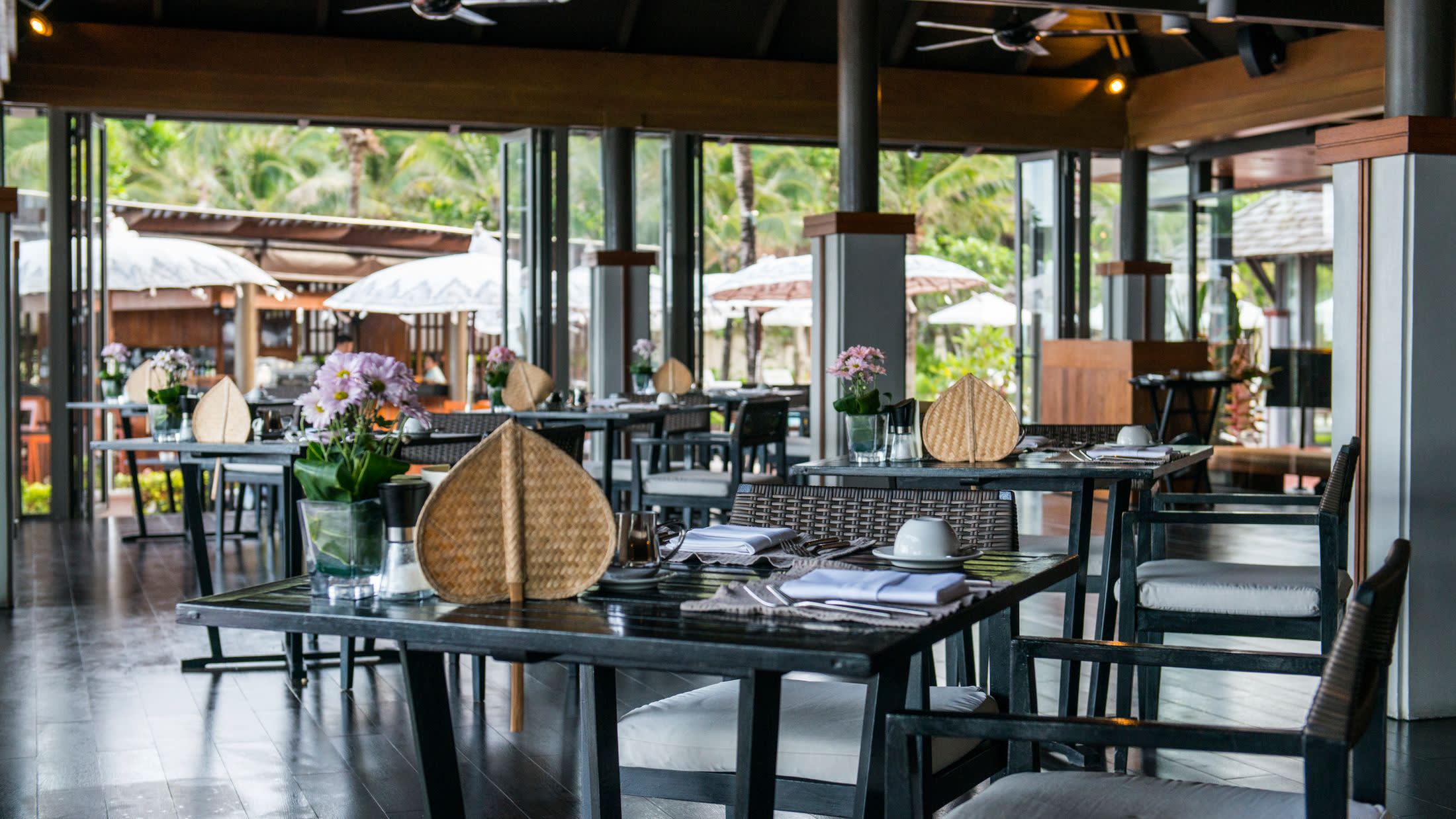 a dining room table in front of a window