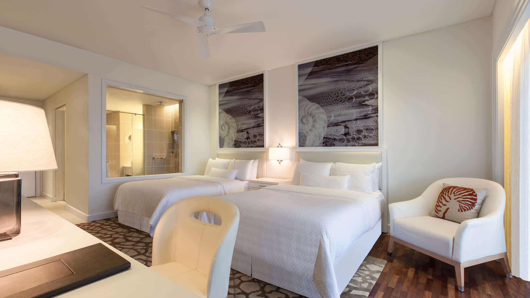 a bedroom with a large bed in a hotel room