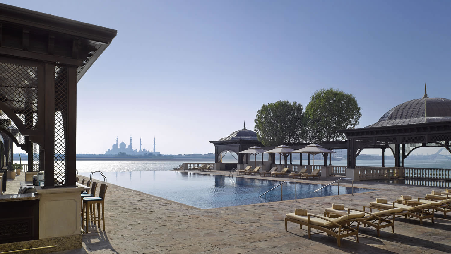 an umbrella sitting on top of a sandy beach