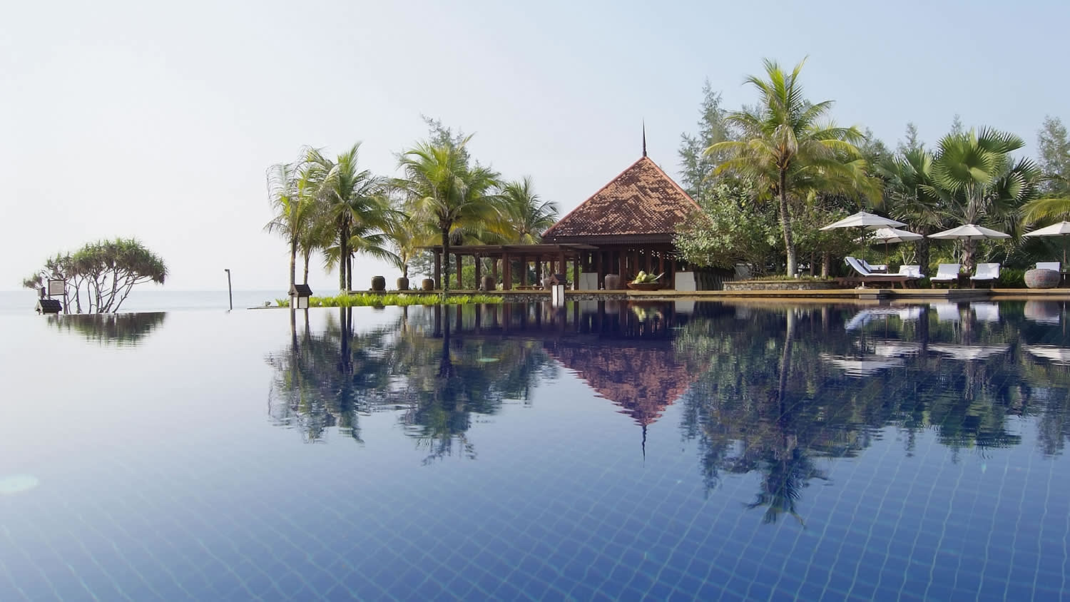 a house next to a body of water
