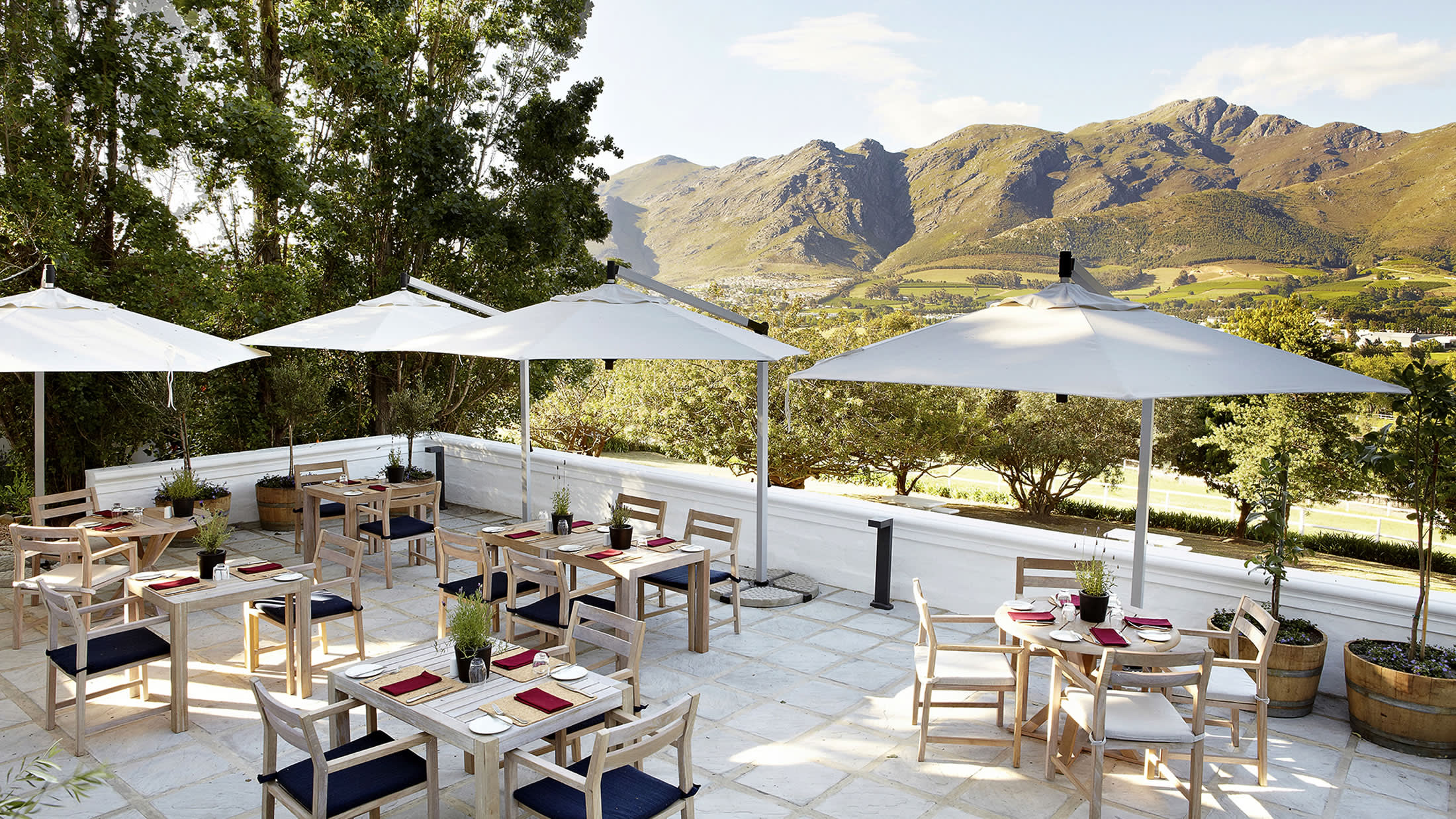a picnic table with a mountain in the background
