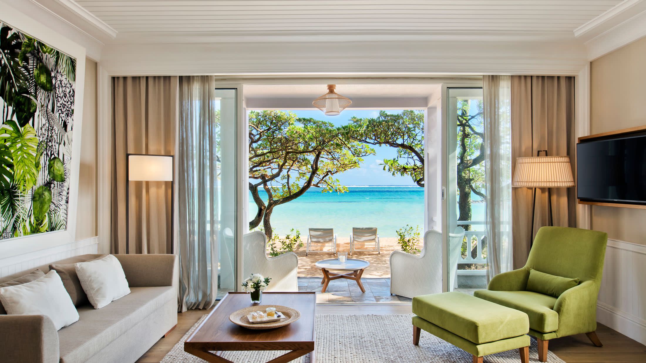 a living room filled with furniture and a large window