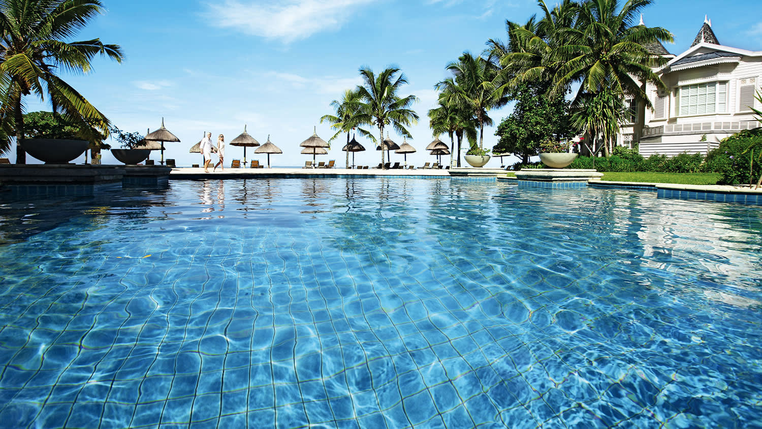 a pool next to a body of water